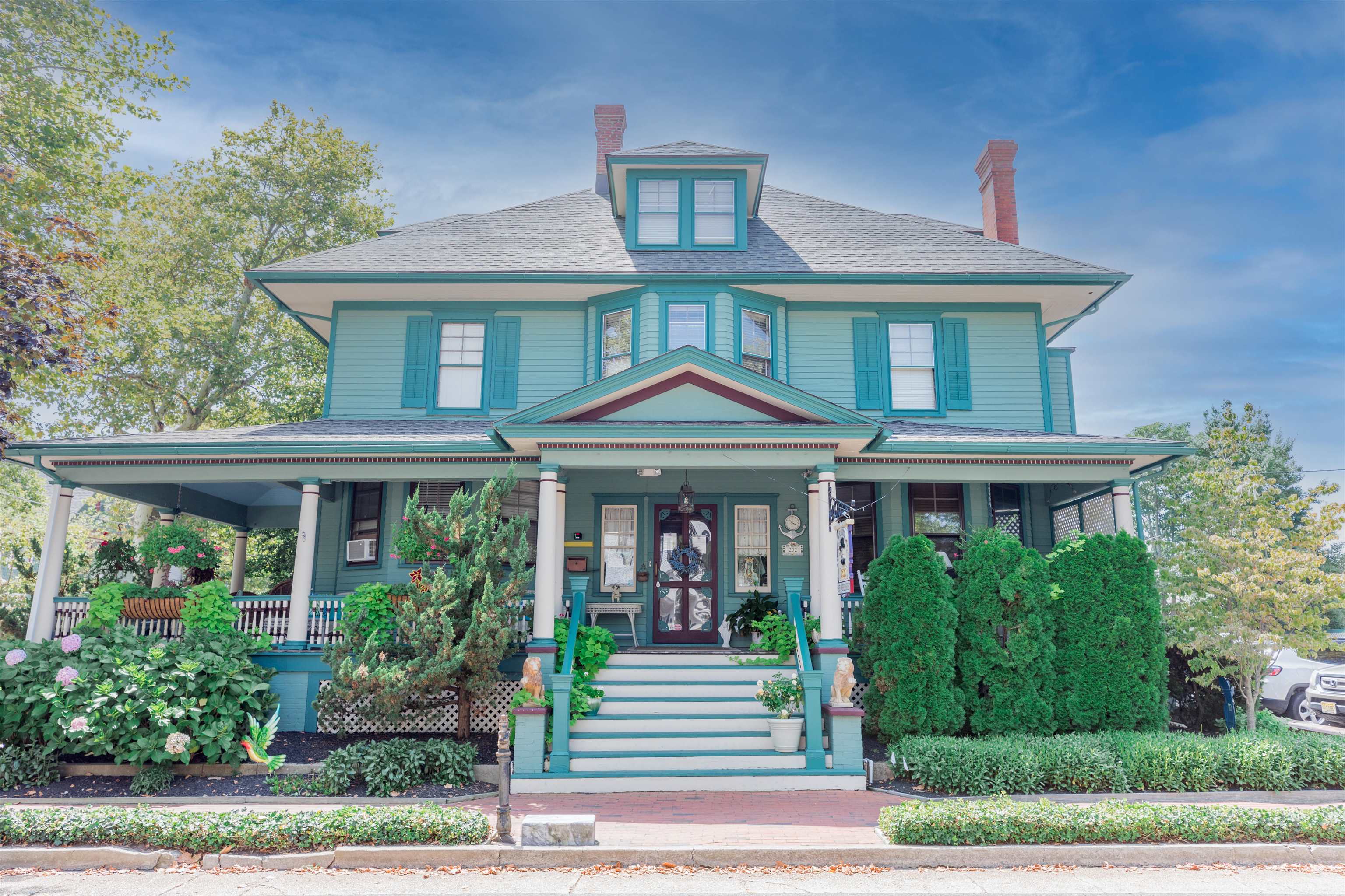 Don’t miss this opportunity to own a piece of Cape May history.  Currently operated as the Captain Mey's Inn, this turn of the century Victorian home, circa 1890 was built by Dr. Walter Phillips.  The corner location just steps to both the mall and beaches of Cape May make this the best location to enjoy all that the wonderful town has to offer.  Make it your own as either a single-family property or maintain the B&B license and continue it as your new creation.  Painstakingly renovated and update while respecting its heritage and original character this 13 bedroom, 11 bath home boasts large scale rooms, elegant detailing and beautiful woodwork throughout. Step onto the front porch that wraps around onto tree lined Hughes Street.  The 1st room upon entry is the Office Quarters (named for the Doctors visiting room).  A large ornate hallway leads to the beautiful living room (parlor) and connects to the fabulous dining room.  Down the hall is the highly desirable Captains Quarters with private bath and side entrance.  Step into the hall bath and head back towards the spacious kitchen, laundry room with steps to the off street parking spot, and the utility room with steps to the private 40 x 100 parking lot.  The 2nd level is home to 4 bedrooms with private baths and a 5th bedroom with a hall bath.  The spacious hallway takes you to the 3rd floor landing with fire escape. The 3rd level is home to 2 large bedrooms with private baths that have whirlpool tubs.  The owner’s quarters are in the lower level and offer a living room, kitchen, 4 bedrooms and 2 baths with an exterior and interior entrance.  Amenities include a new roof, recently stained wood siding, numerous stained-glass pieces that have been restored, oak and pine floors, new gas HWH, pecks plumbing, Shore’s security system and a State Fire Inspection. The parking lot owned as a separate parcel offers 8 parking spots and a picnic area.  The brick sidewalk adds that last touch of beauty!  Showings by appointment only due to a working business.