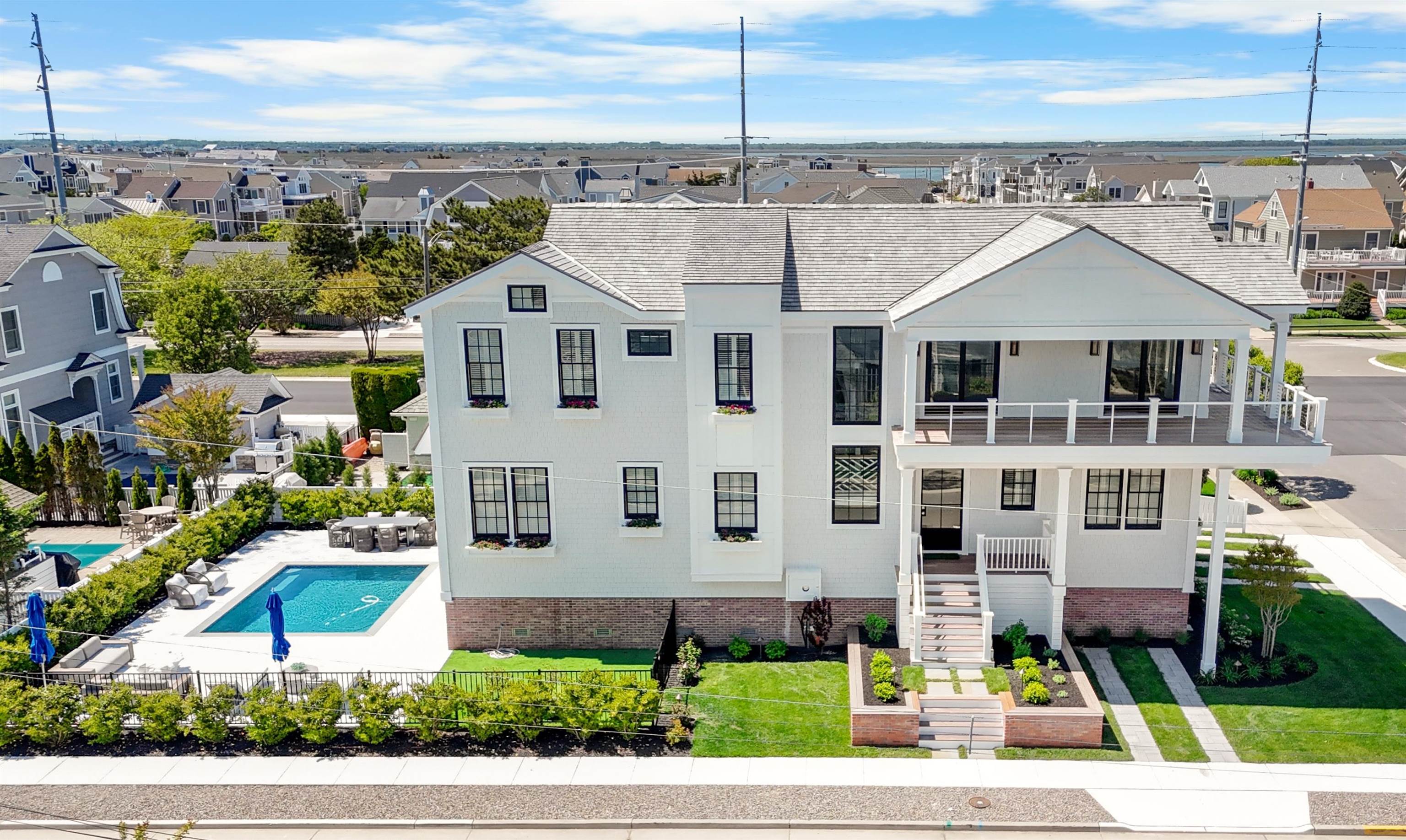 Fabulous corner location on coveted Pennsylvania Avenue, With expansive views down 86th Street to the ocean and some of the best beaches in the area this home is also situated close to the vibrant downtown Stone Harbor business district.  With 6 full bedrooms, 6 full ensuite baths and 2 half baths, this home will also feature natural stone and porcelain tiling, Thibault wall coverings, custom woodworking and trim, plantation shutters and motorized blinds.  Vaulted ceilings and oversized windows in the living, dining and kitchen areas on the second floor will allow natural light to pour inside and grace the exquisitely textured finishes throughout.  A separate family room on the first floor overlooks the expansive 2,000 SF pool area patio out back.  An outdoor kitchen and grille station will also allow for poolside entertaining after a relaxing day on the beach.  Other amenities include: Cedar shingle roof, Hardi-Shingle siding; Sub-Zero / Wolf Appliances, Finest quality flush inset cabinetry with 5/4" doors, Kohler plumbing fixtures, Wire brushed white oak engineered hardwood flooring throughout, Sonos A/V system, Oversized 14' x 22 gunite pool by Avalon Pools, Inc., 1,500 SF of area at 6 foot height in crawl space for storage; 580 SF of decks with views at second floor, Landscaping and Flower boxes by Garden Greenhouse and Nursery,  Fully furnished inside and out by Restoration Hardware.