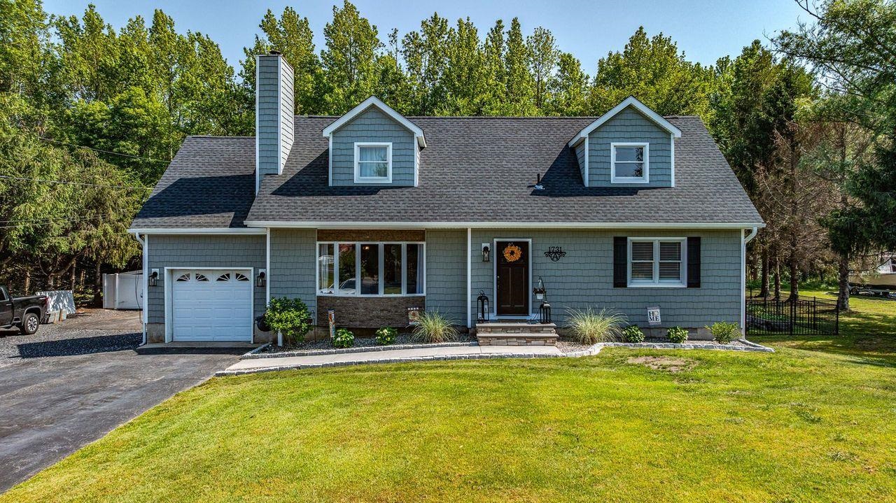 Welcome to this beautifully renovated two-story home offering 5 bedrooms, 2 full bathrooms, and exceptional updates throughout. Thoughtfully upgraded from top to bottom, this home features brand-new flooring, Andersen 400 Series windows with craftsman-style trim, and a completely redesigned kitchen (2023). The gourmet kitchen is a showstopper, featuring new cabinetry, sleek quartz countertops, and stainless steel appliances. Unwind in the light-filled Florida room or step outside to enjoy the newly built, stained deck—perfect for relaxing or entertaining. The backyard is equally impressive with a newly poured concrete patio and sidewalk, black metal fencing, and white privacy fencing—all completed in 2023/2024. Downstairs, you’ll find two spacious bedrooms, including one with an en-suite full bath. Upstairs offers three additional bedrooms and a fully renovated full bathroom. The oversized primary bedroom includes a generous closet with space and flexibility for your lifestyle needs. Major updates include a brand-new roof with 30-year GAF shingles and flashing (2024), new siding and additional flashing (2025), all-new gutters, soffits, and fascia, and a stylish new front door (2024). Situated on almost 3 acres with a secondary driveway, this move-in-ready property offers space, privacy, and endless possibilities. Whether you’re looking for room to grow, host, or simply relax—this home has it all. Schedule your private showing today—your dream home awaits!