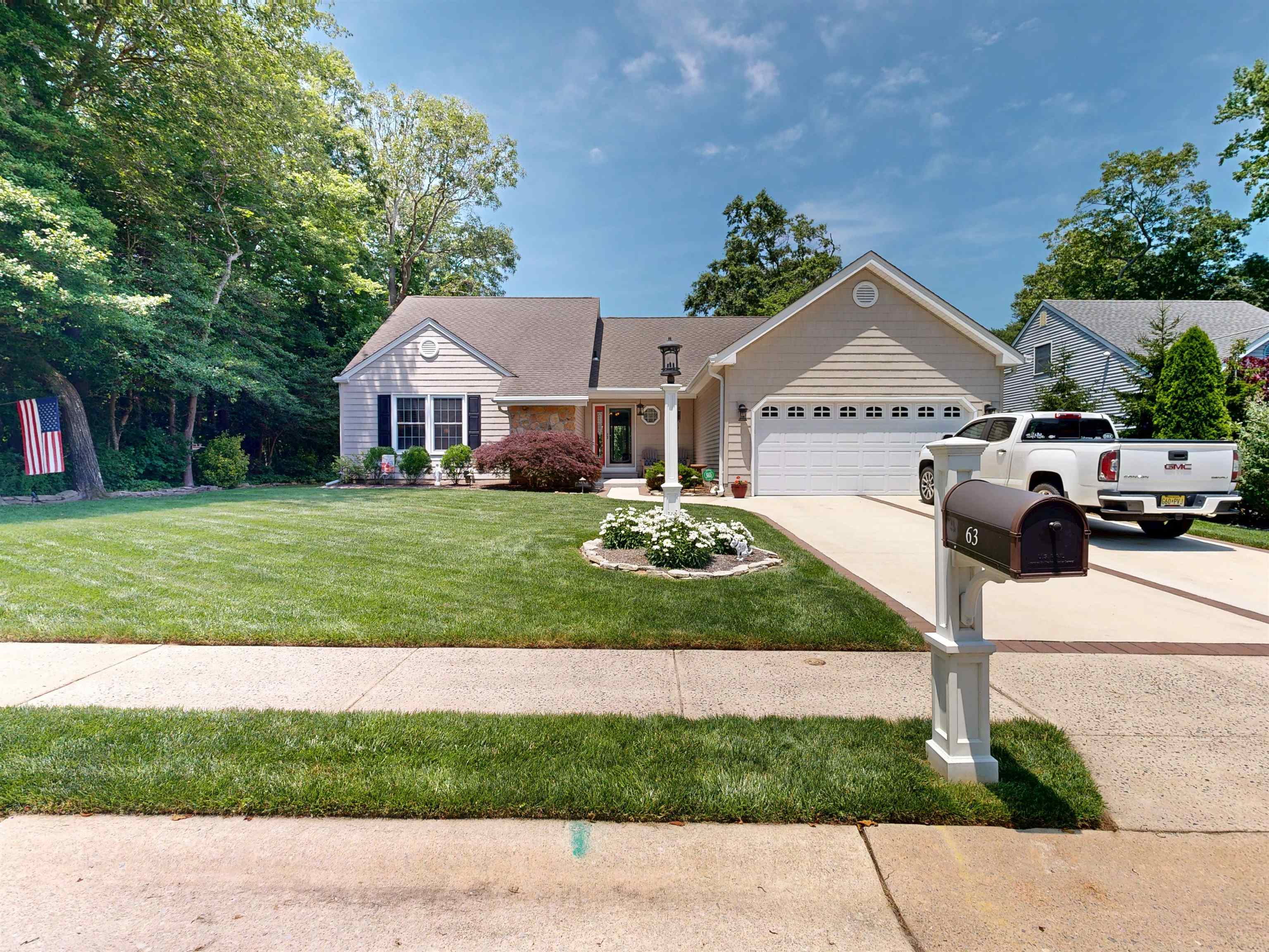 Welcome to 63 Cape Woods Road, situated in one of North Cape May’s most desirable neighborhoods. This meticulously maintained 3-bedroom, 2-bathroom ranch-style home offers the perfect blend of comfort, style, and functionality in a peaceful, established community. Upon entering, you’re greeted by soaring cathedral ceilings, an open-concept layout, and abundant natural light reflecting off gleaming Pergo floors. The kitchen, located to the left, features quartz countertops, stainless steel appliances, and a large center island with seating that seamlessly flows into the main living and dining areas, as well as the rear sunroom, perfect for everyday living or entertaining. The private primary suite is tucked away on the same side and boasts a spacious layout with a full bathroom complete with tile floors, a tile shower with tub, a double vanity, and a huge walk-in closet. On the opposite side, you’ll find two additional bedrooms and the second bathroom, which includes a large single vanity, tile shower with tub, and tile floors. Just steps away, the conveniently located laundry room offers direct access to the two-car garage for added ease. Just off the living area, through the double doors, lies a spacious deck featuring a hot tub, your own tranquil paradise. Down the steps you’ll find a beautifully designed backyard oasis with a paver patio sitting area, a storage shed, and a private outdoor shower. The fenced-in yard, complemented by mature landscaping, gutter guards, and an irrigation system, ensures low maintenance and privacy. A reliable generator and one year old HVAC System adds peace of mind. Just a short drive from the beaches of Cape May, and the Wildwoods, you’ll have easy access to local shopping, dining, wineries, and breweries, everything you need to embrace the vibrant shore lifestyle to the fullest.