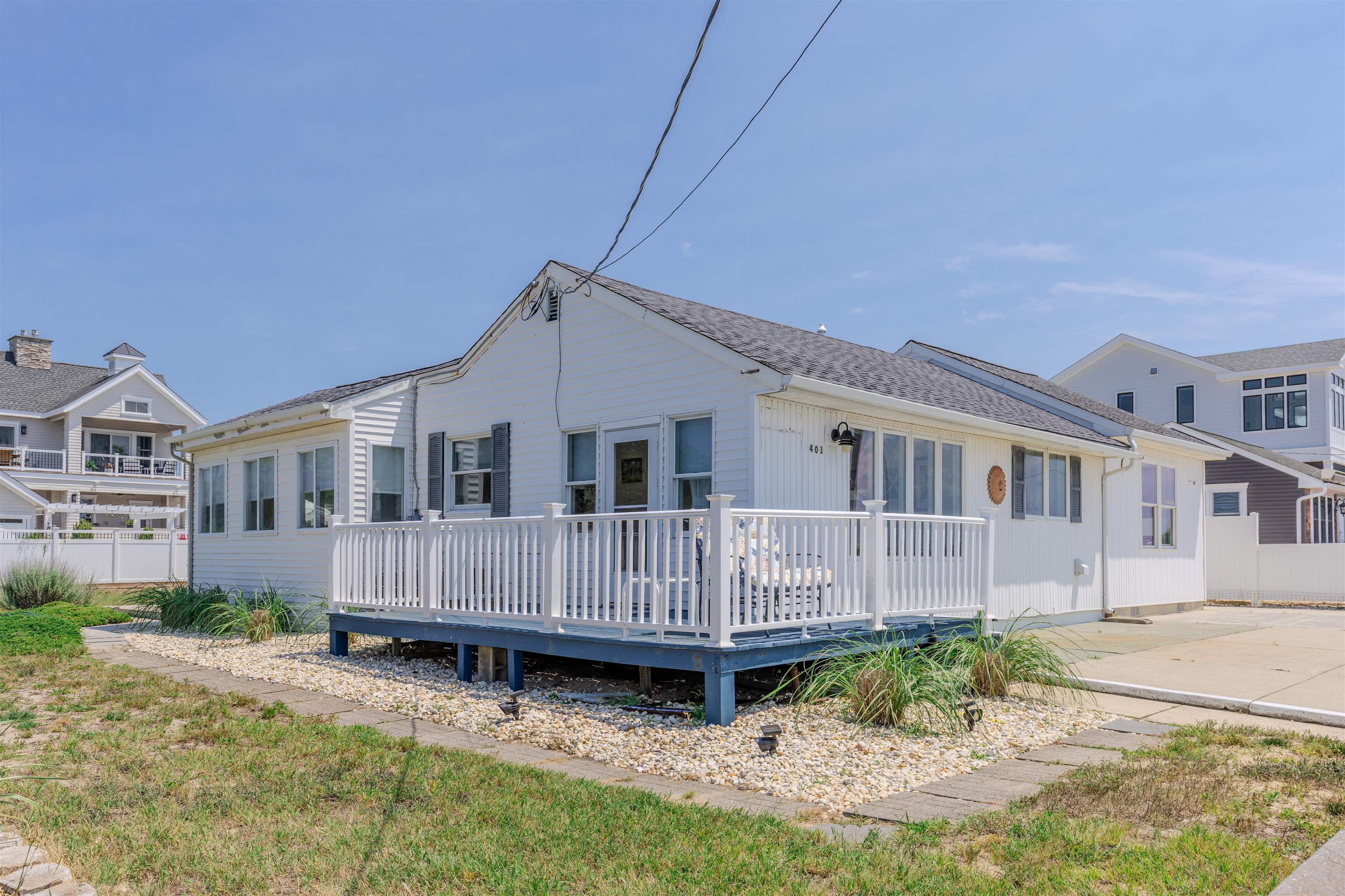 Bayfront Corner Property – Oversized Lot with Stunning Views. Welcome to this exceptionally located bayfront corner property situated on a generous 80 x 125 lot. This beautifully maintained 3-bedroom coastal cottage offers spectacular, unobstructed views of the Delaware Bay, with world-class sunsets visible from nearly every room. Whether you're enjoying a peaceful morning yoga session, hosting guests for sunset cocktails, or simply unwinding, the ever-changing views of the bay, passing boats, and playful dolphins are always on display. Inside, you'll find three comfortably sized bedrooms and one tastefully updated bathroom. The interior is bright and welcoming, with coastal-inspired finishes that make the home feel open, airy, and uplifting. The charming white kitchen, featuring granite countertops and an island with seating, serves as the heart of the home — ideal for both casual meals and social gatherings.  French doors lead into a spacious family room with vaulted ceilings, perfect for relaxing or enjoying game nights. Additional highlights include luxury vinyl plank flooring, a dedicated laundry room, newer HVAC system, and a low-maintenance yard complete with a storage shed.  With ample outdoor space, there’s room to add a pool, expand the current home, or even build up for twice the panoramic views. The home is being sold furnished, making it a move-in ready coastal escape.  Located just steps from the sandy beaches and directly across from the bay, this is the ultimate beach lover’s getaway. Priced to sell in its current condition. Showings are available by appointment only from 2:00 to 3:30 PM on Saturday.