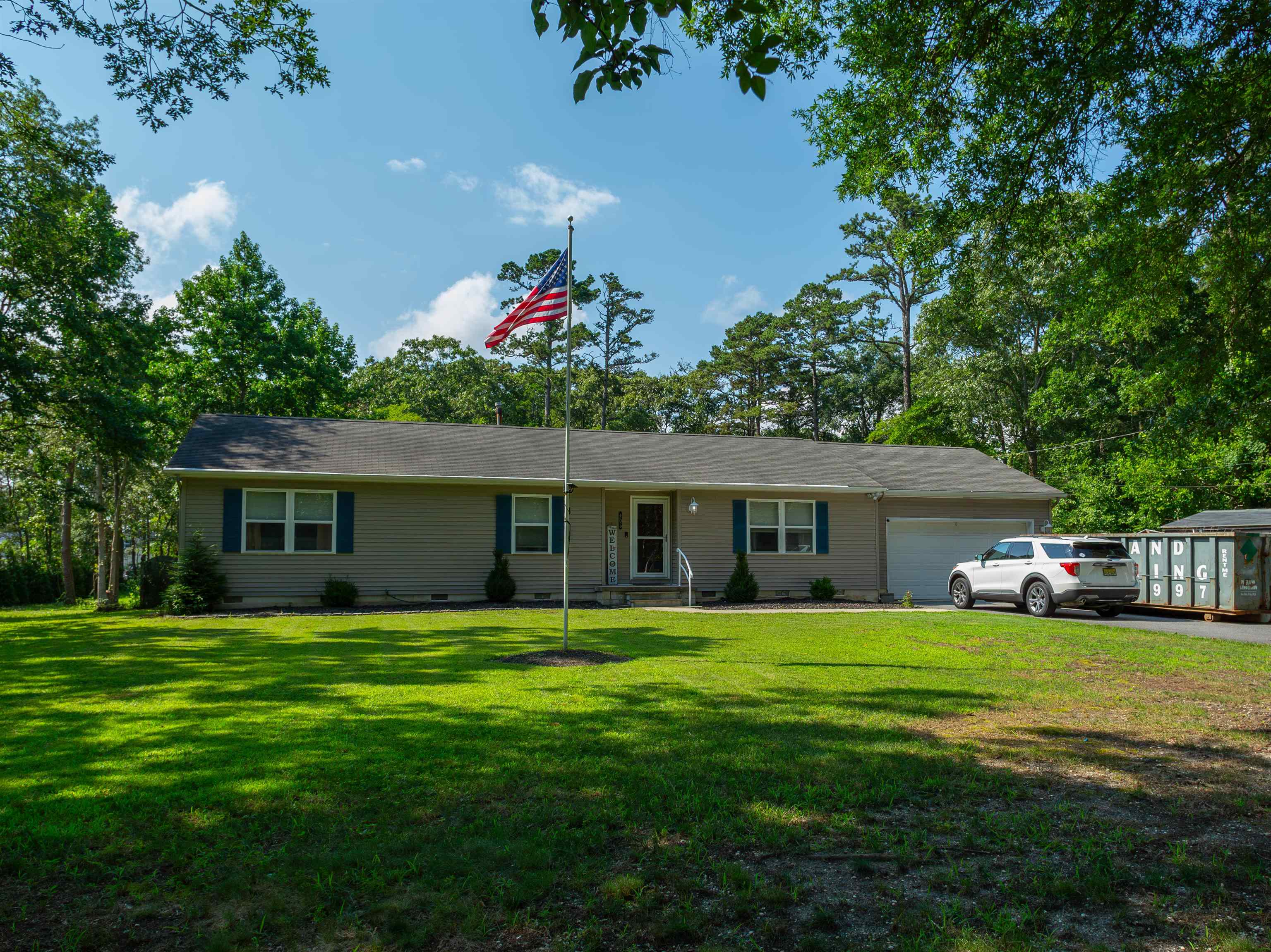 Enjoy the Best of Both Worlds — Privacy & Proximity! Nestled at the end of a quiet cul-de-sac and just 3.9 miles from the beautiful beaches of Sea Isle City, this renovated (2020/2021) 4-bedroom, 2-bath home offers the perfect blend of peaceful living and coastal convenience. Set on just over 1.3 acres, this property features a fully fenced backyard, spacious deck and patio, deck furniture, and grill—perfect for outdoor entertaining. Step inside to the gourmet kitchen equipped with Hampton Bay Shaker cabinetry, quartz countertops, a peninsula with seating for four, Samsung stainless steel appliances, and pantry—a dream for any home chef. The primary suite offers a serene retreat with a full wall closet and a luxuriously remodeled master bath featuring marble tile and an extra-deep soaking tub. Three additional spacious bedrooms with generous closet space provide plenty of room for guests, family, or a home office. Additional features include Oversized 1.5-car garage with built-in storage and rear patio access. Pull-down attic access spanning the garage and full home. Brand new central A/C system (2020) Tankless natural gas hot water heater (2019) Radiant gas heat and whole-home water treatment system (2017) This move-in-ready home has been lovingly maintained and upgraded—just bring your bags and settle in! Call listing agent today for your private tour or more information today!