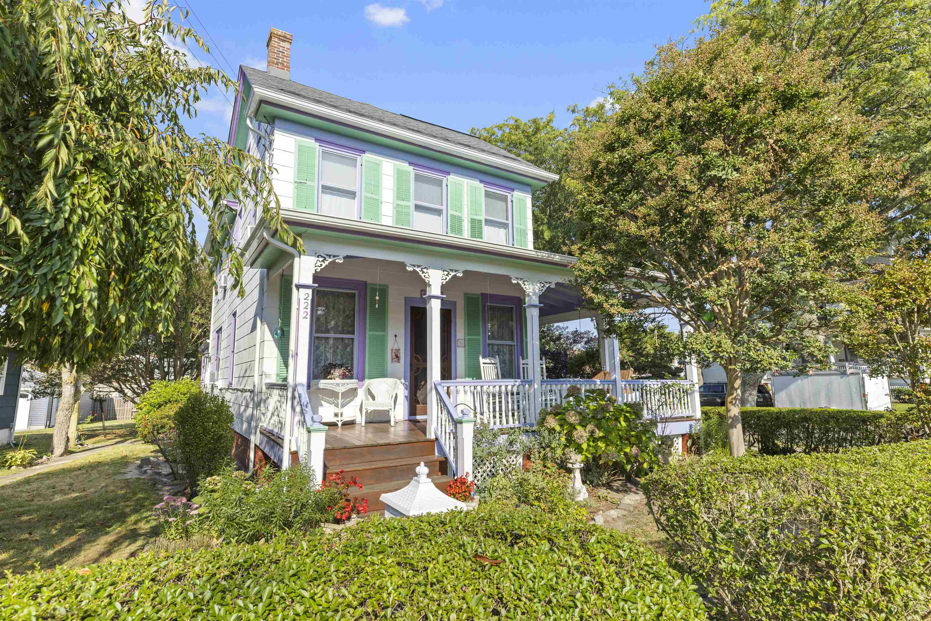 Charming West Cape May Classic on a Corner Lot! Built in 1905, this timeless home exudes character and has been lovingly cared for by the current owner since 1999. Ideally situated on a desirable corner lot, 222 Broadway is close to everything Cape May offers — beaches, restaurants, and boutique shopping are all within easy reach. Step onto the welcoming front porch and into a home filled with warmth and history. Once the residence of Dr. Eldredge, the property still features a second entrance that once served as his office entry. Inside, beautiful wood floors flow throughout the spacious living areas, including a front living room, dining room, and a flexible family room that could also serve as a first-floor bedroom. The kitchen offers Corian countertops, wood cabinetry, and easy access to a laundry room with a convenient half bath. Upstairs you’ll find three comfortable bedrooms and a large full bath, while the third level provides excellent storage space. The basement, with both interior and exterior entrances, adds additional practicality. Recent updates include a new roof (2024), Navien natural gas baseboard heating system (2018), and a one-car garage addition. Outdoor features include a delightful outside shower, lovely gardens, and lush landscaping that complement the home’s charm. Well maintained and rich with Cape May history, this inviting property blends classic appeal with thoughtful upgrades — the perfect place to enjoy all that West Cape May has to offer.