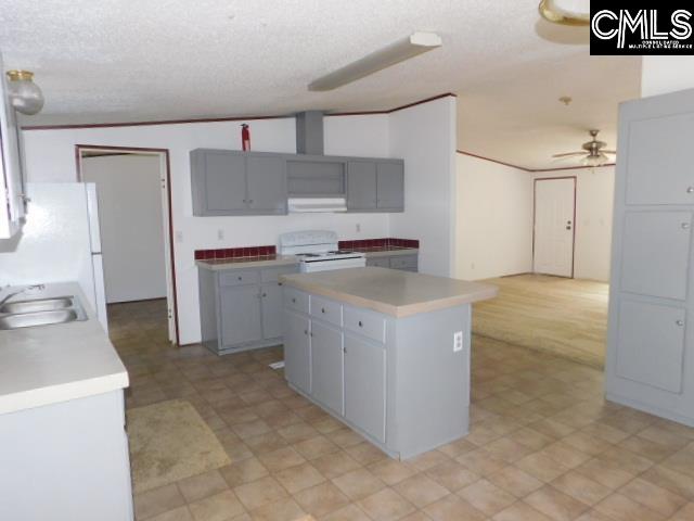 FEATURES ISLAND, NEW FRIDGE, STOVE AND NEWLY PAINTED CABINETS...