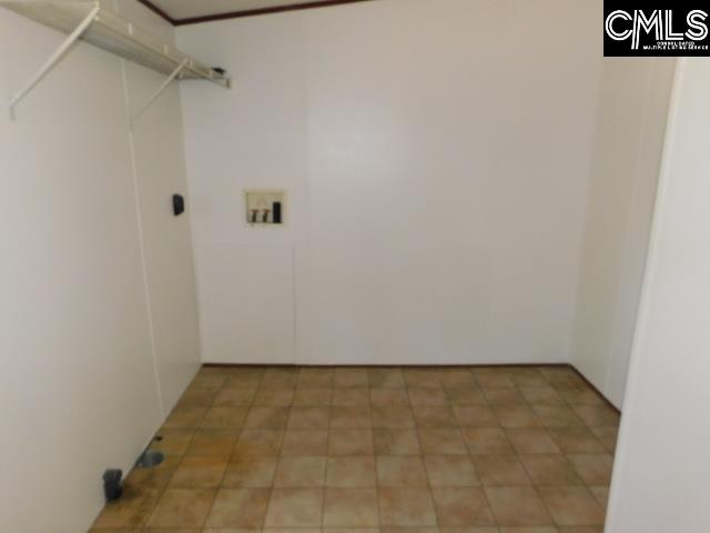 FEATURES A SPACIOUS AREA WITH A SEPARATE DOOR FOR DROPPING DIRTY CLOTHES FROM DOING THE YARD...