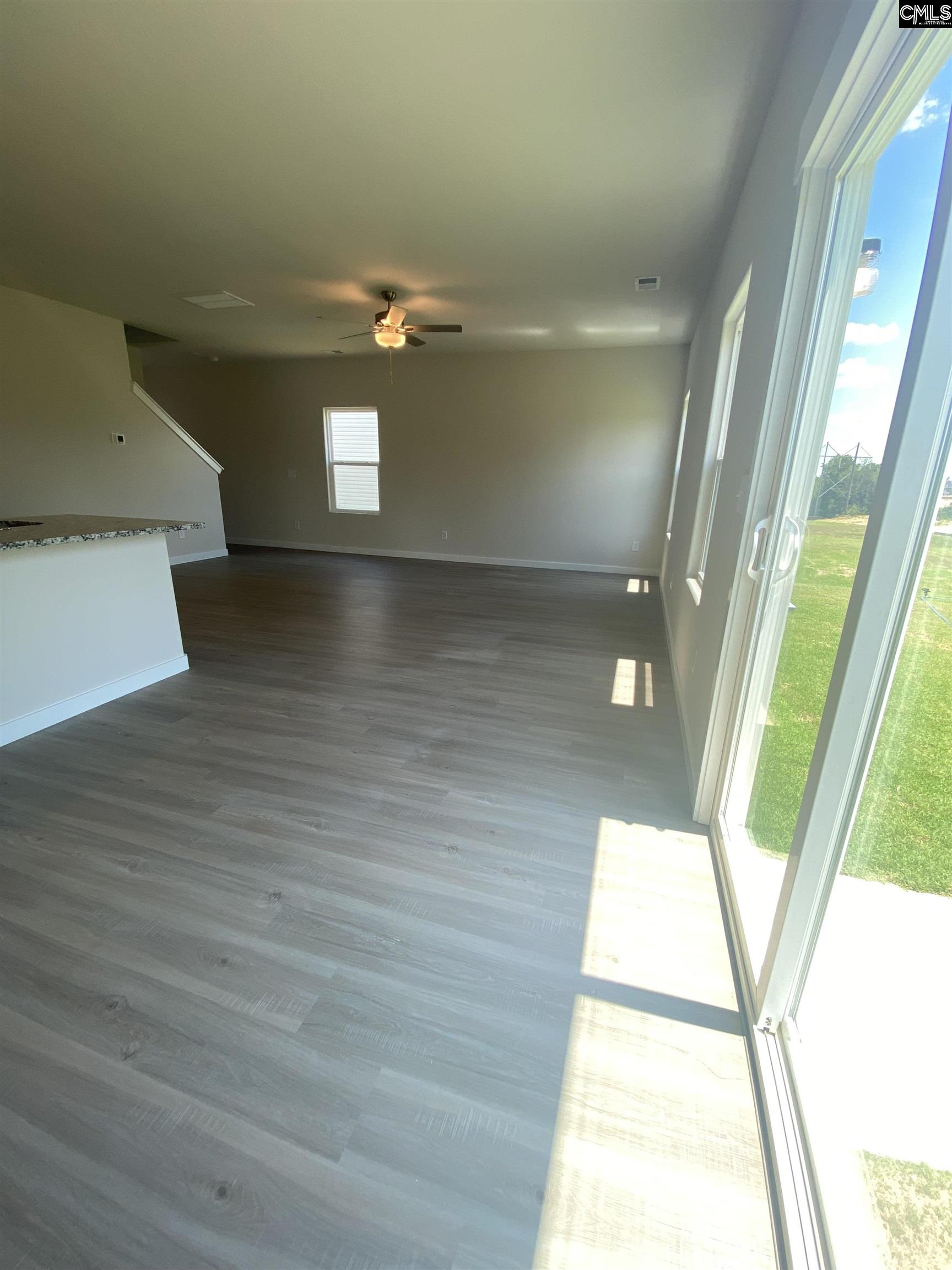 Located off the kitchen, the dining nook showcases luxury vinyl plank flooring and a large window.