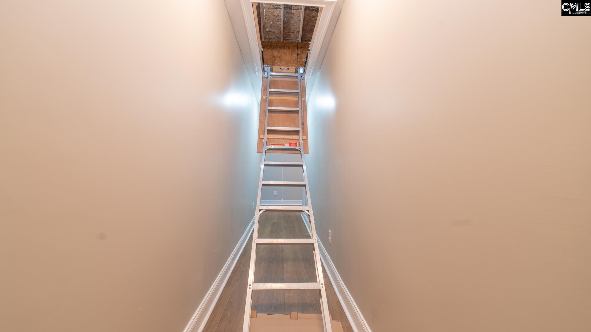 Reinforced Utility Ladder access to the well-insulated Attic with Storage.