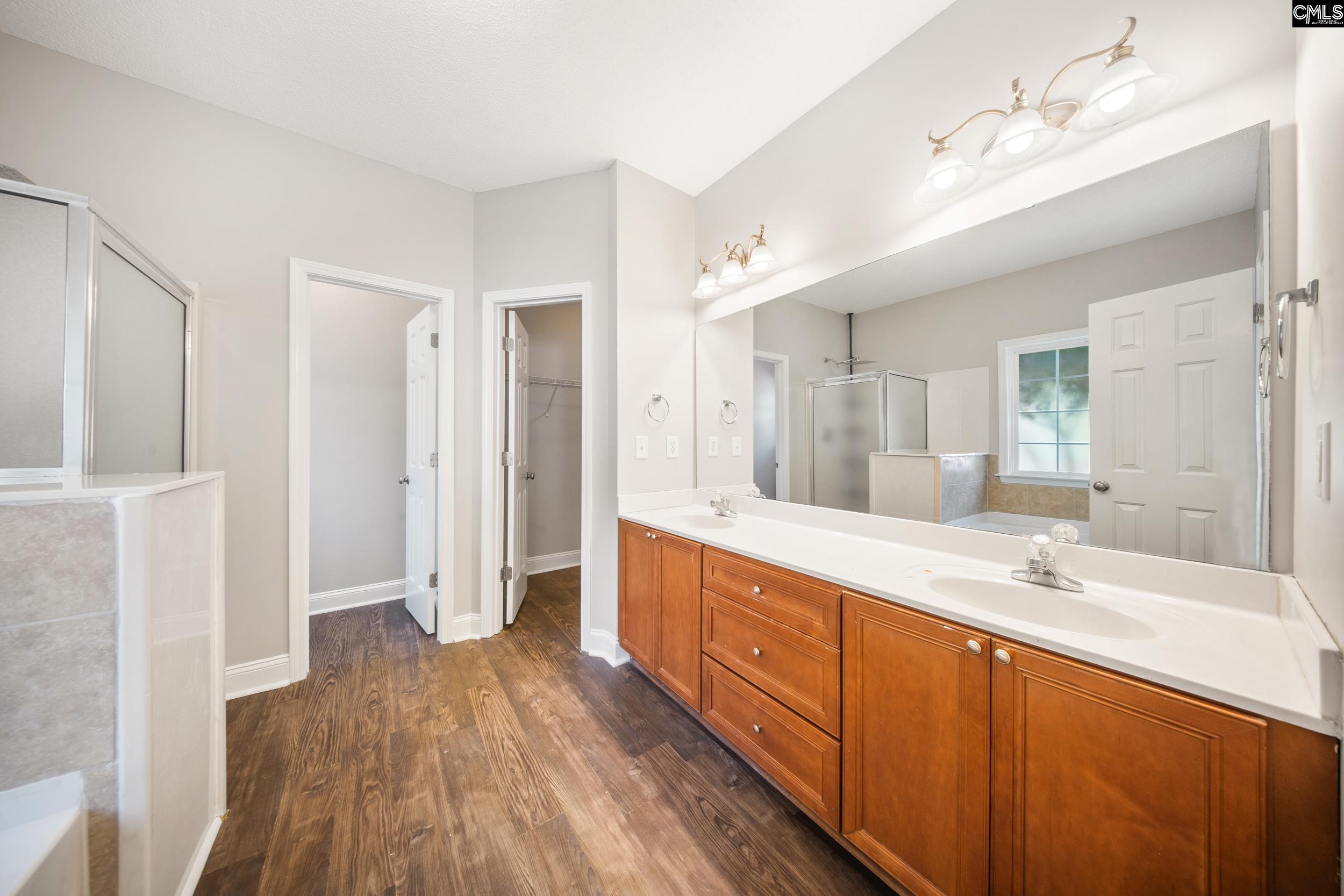 Separate water closet, shower, double vanity, large walk in closet and brand new tub & tile!