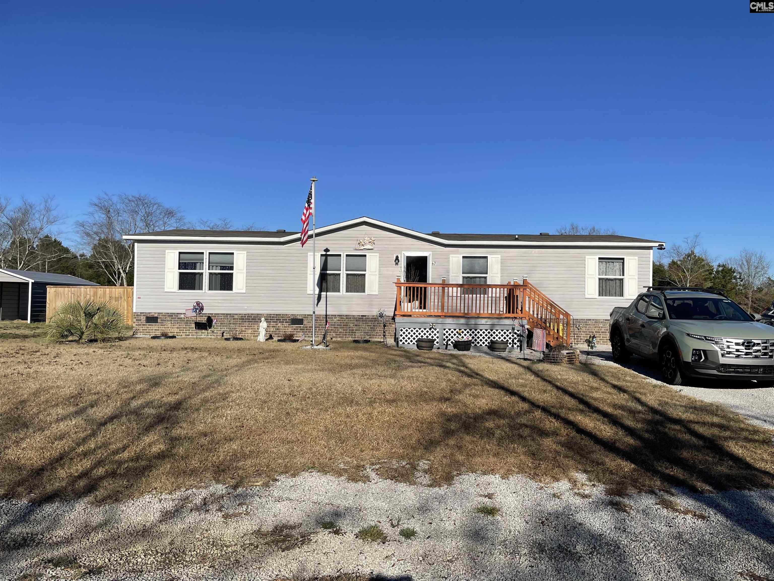 Welcome to your dream home in Lynchburg SC! This stunning manufactured home boasts plenty of room for the families that love to entertain. The interior features ne LVP flooring throughout, a chic butcher block island in the kitchen, and top of the line stainless steel appliances. Step outside to your own private oasis that features an sparkling above ground pool perfect for all the summer gatherings, or just relaxing on the weekend. The fully fenced in back yard provides privacy and security for the kids and pets to play freely. Plenty of storage offered with two new storage sheds. Don't miss out on this beautiful home! Disclaimer:  CMLS has not reviewed and, therefore, does not endorse vendors who may appear in listings.