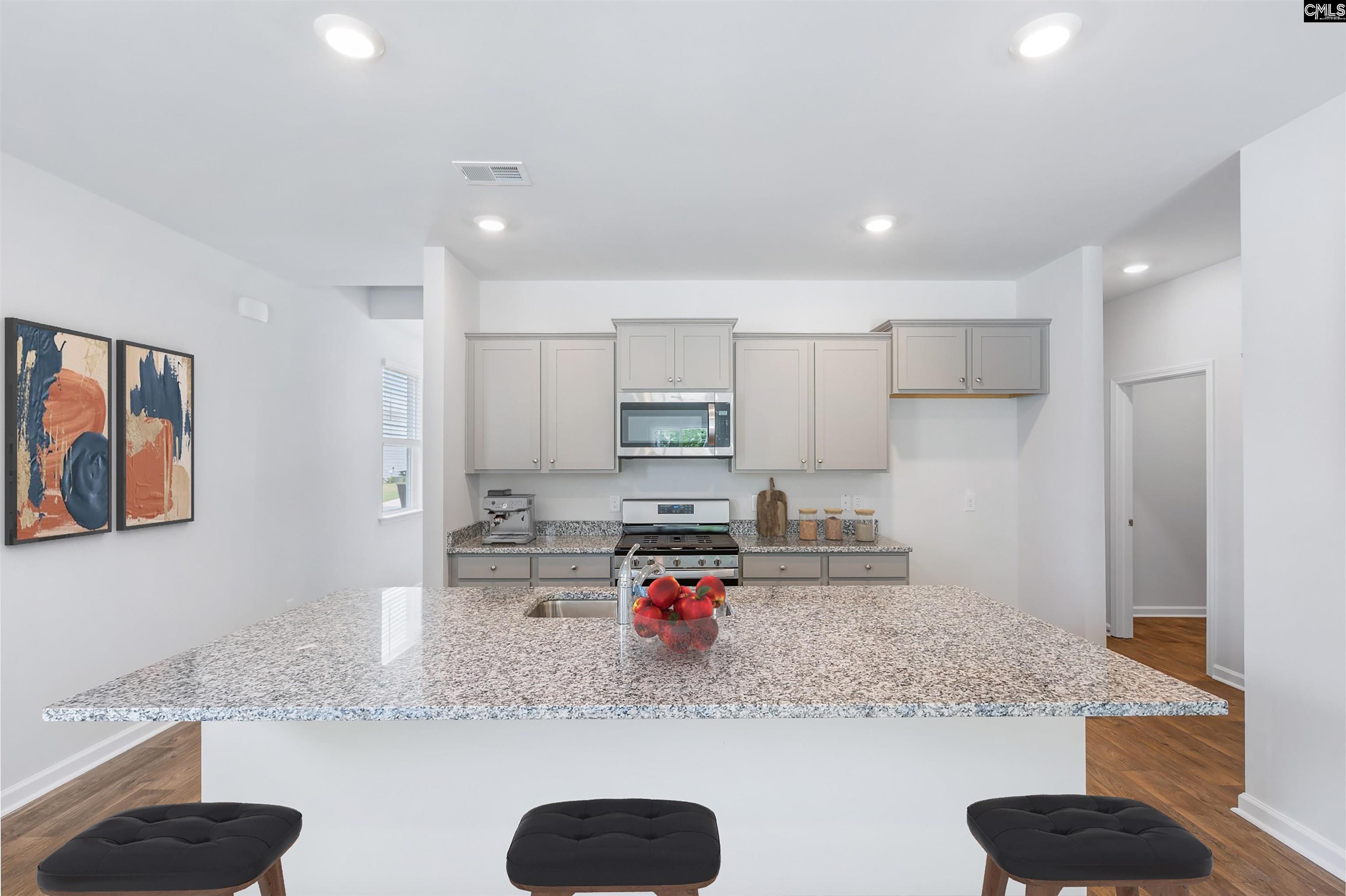 *Pictured with gray cabinets, but this home will have white cabinets