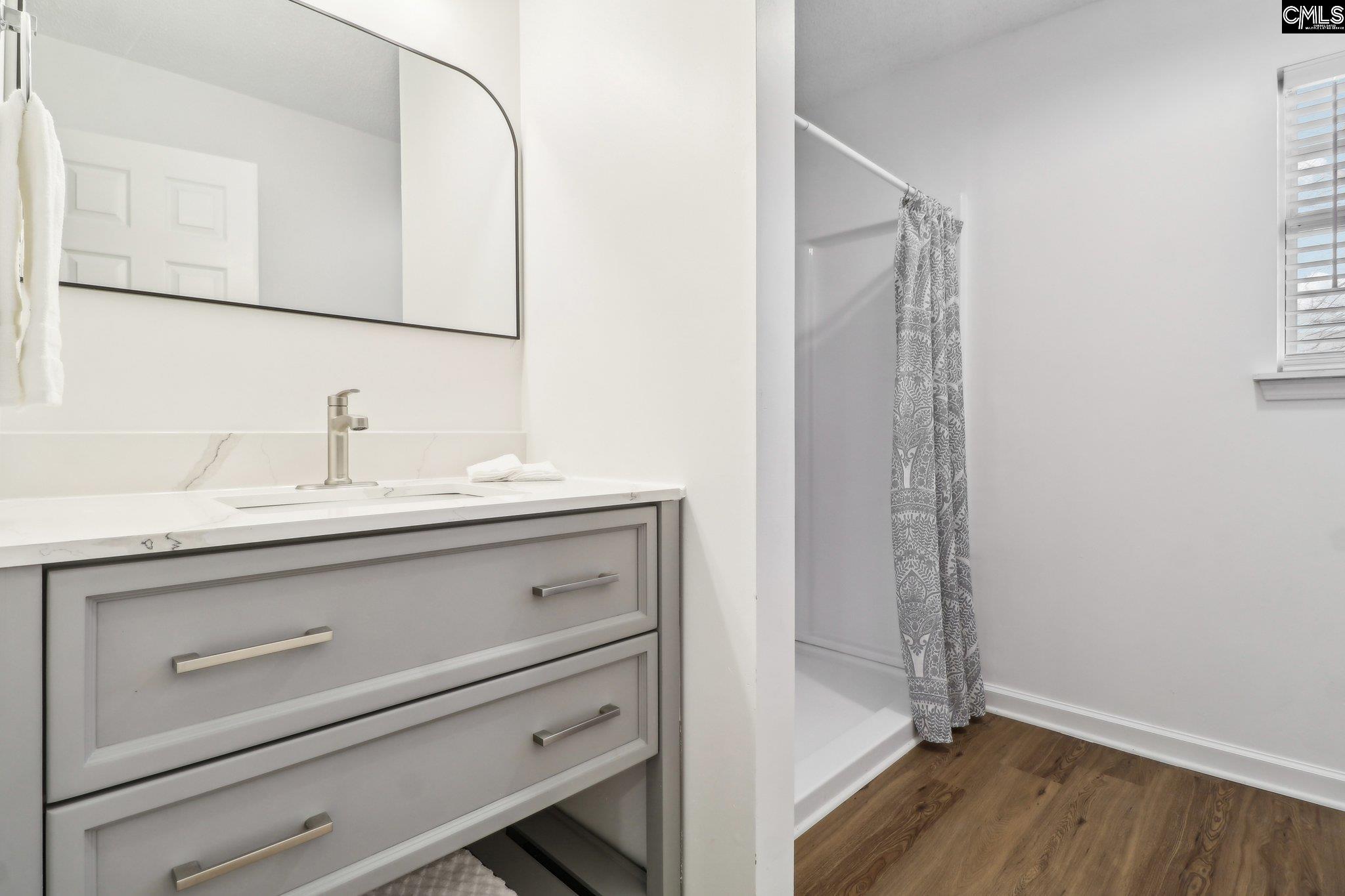 New- Shower, Vanity with quartz countertop, lighting and faucet