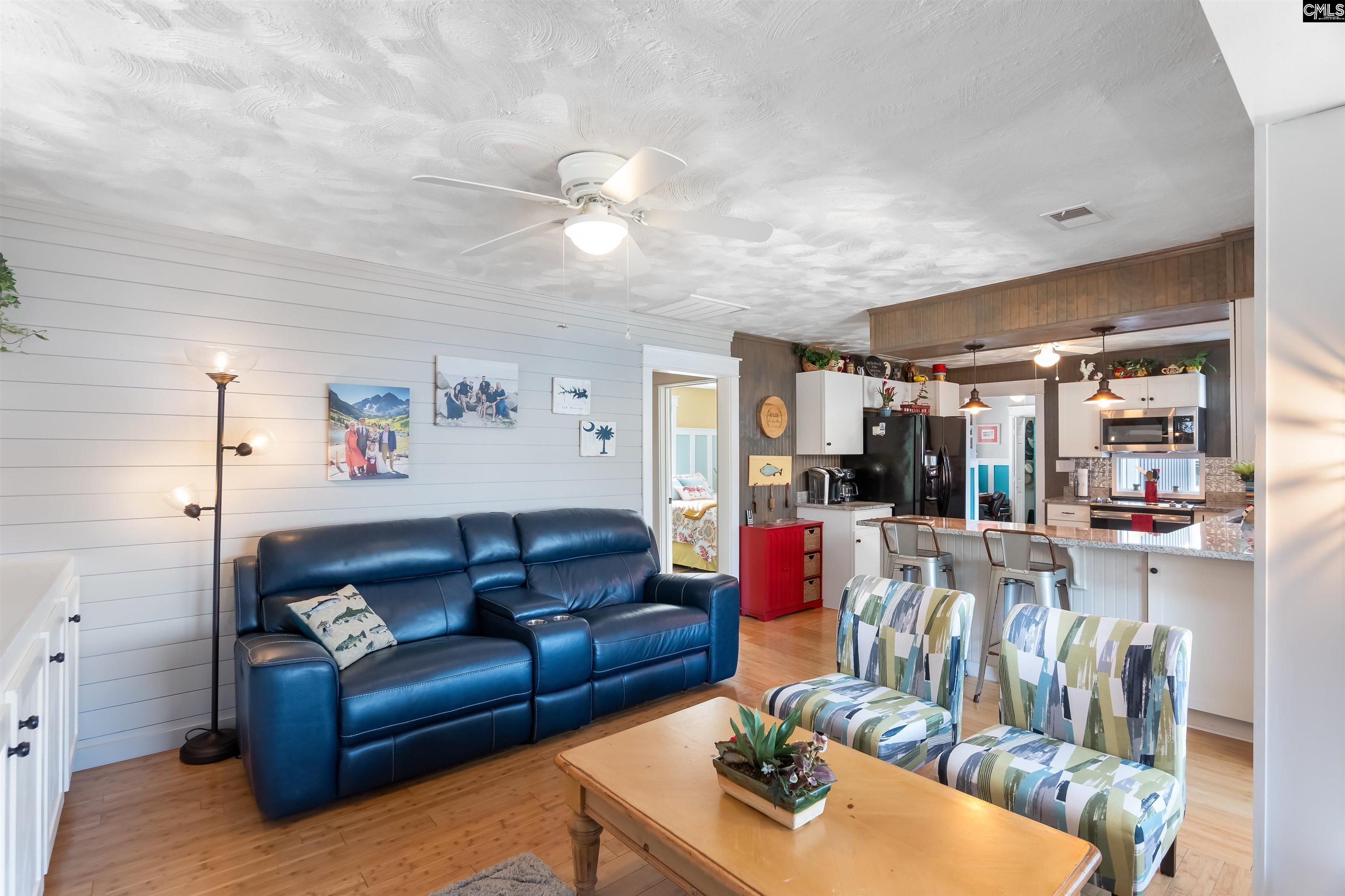 This area is open to the kitchen, sitting room and the dining area. Enjoy the TV or the fire place