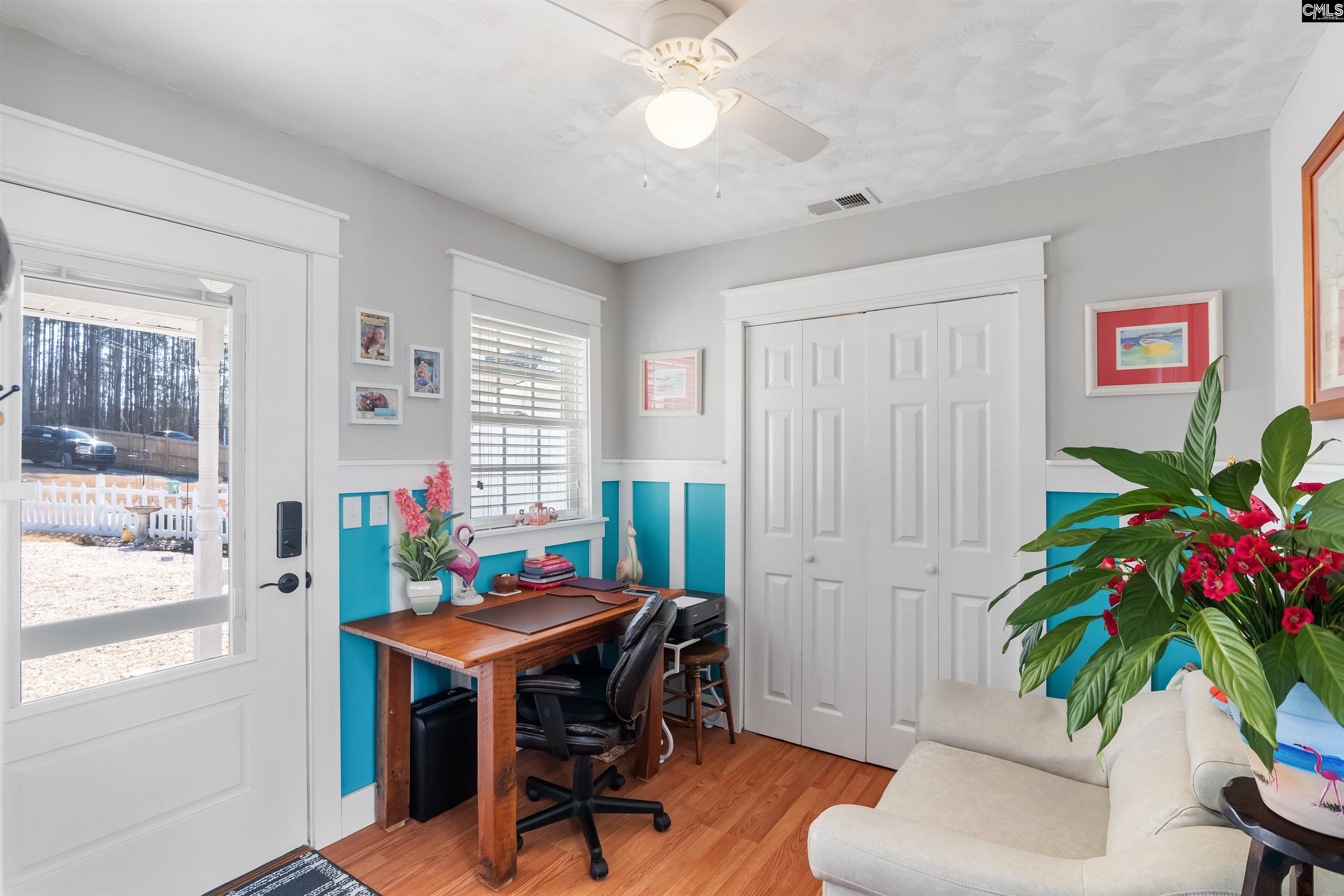 Currently used as small office. Front & rear exterior doors. Closet area with stackable washer/dryer
