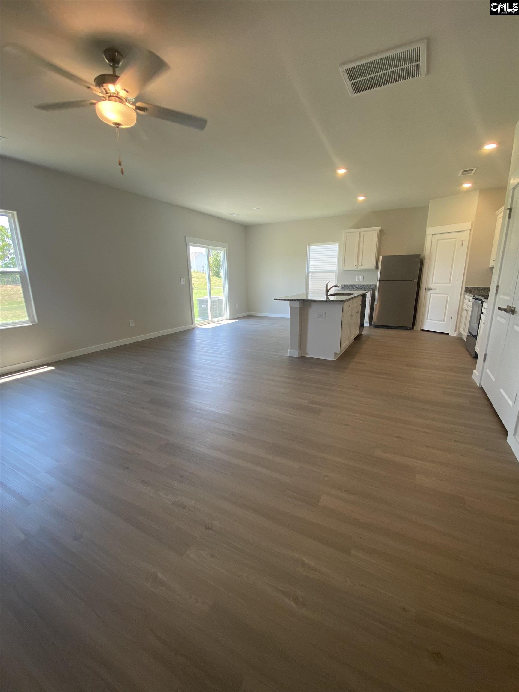 The large family room is located directly off the kitchen, allowing for plenty of room to entertain.