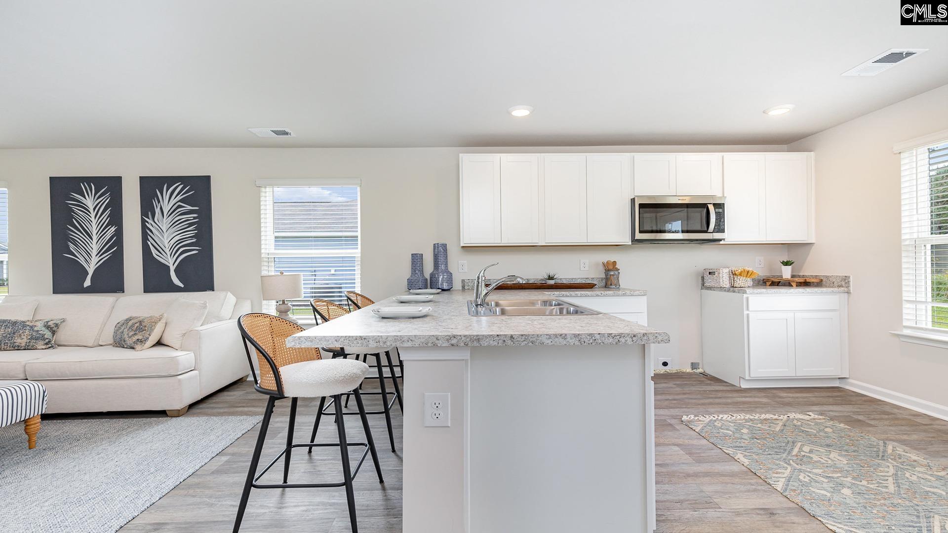 (White cabinets are pictured, but this home will feature GRAY cabinetry)