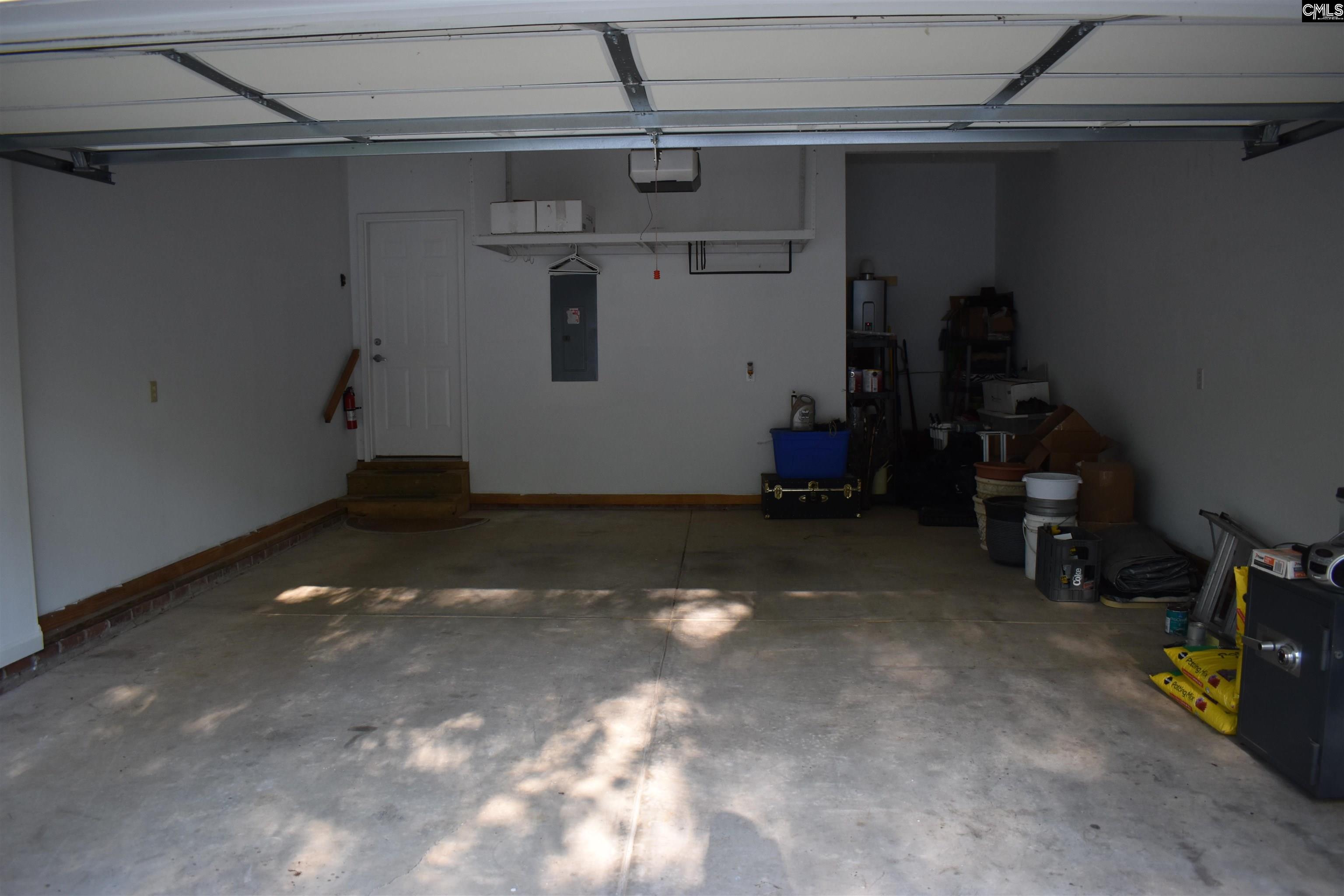 Lots of suspended storage over the garage door and wall going into house