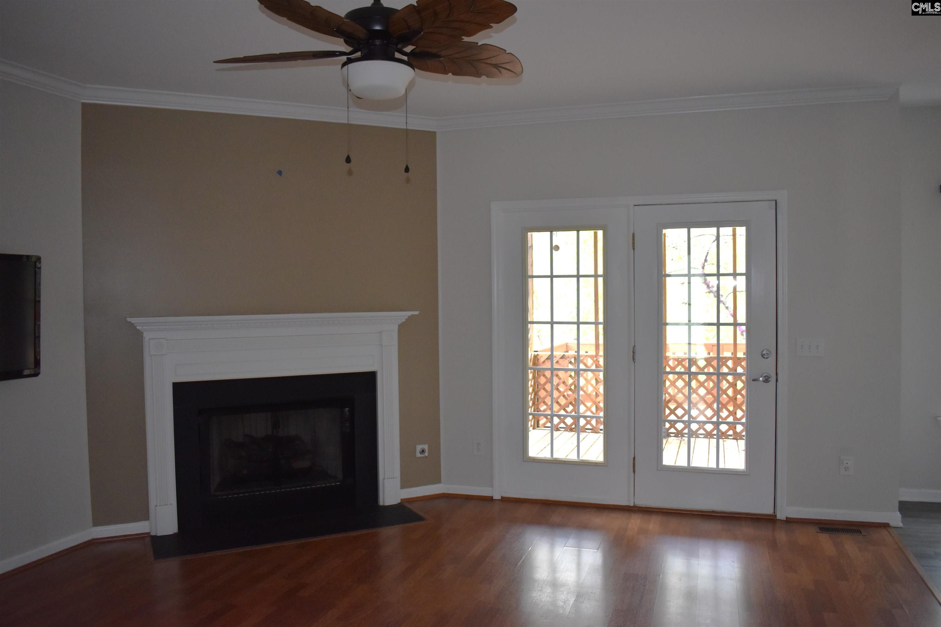 Living room with view of french doors leading to the screened porch