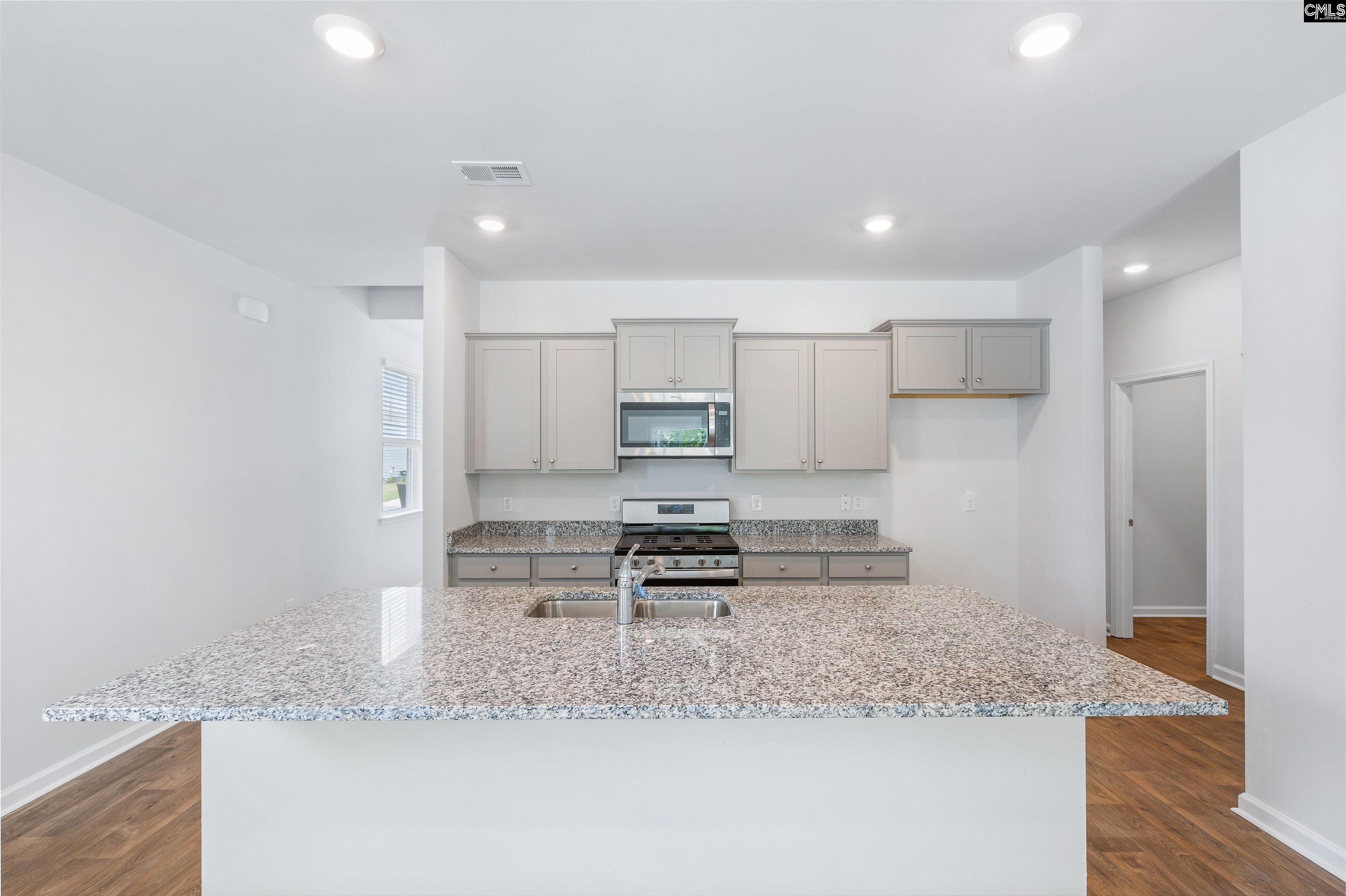 *Pictured with gray cabinets, but this home will have white cabinets