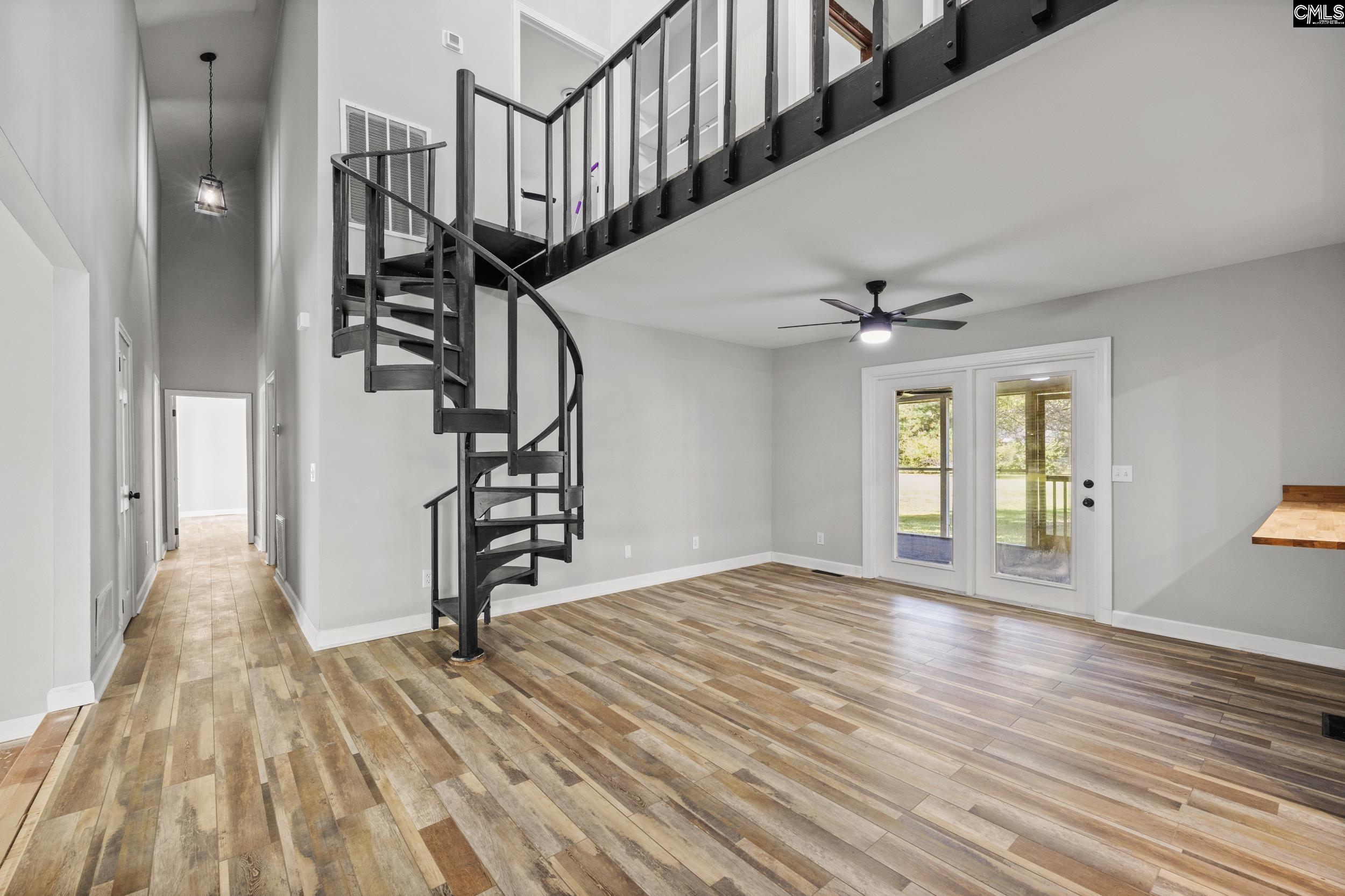 Bedrooms down the Hall. French doors lead outside to the Screened In Porch.