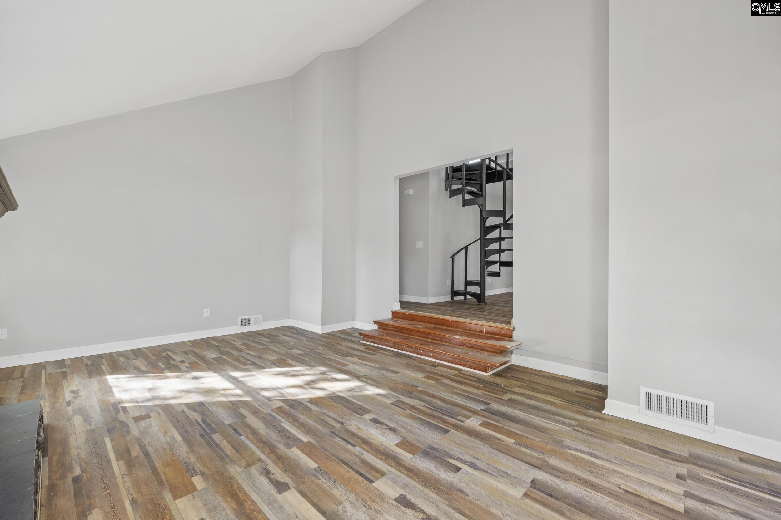 Walkthrough up the stairs to Living Room Area. Bedrooms to the left. Kitchen to the right.