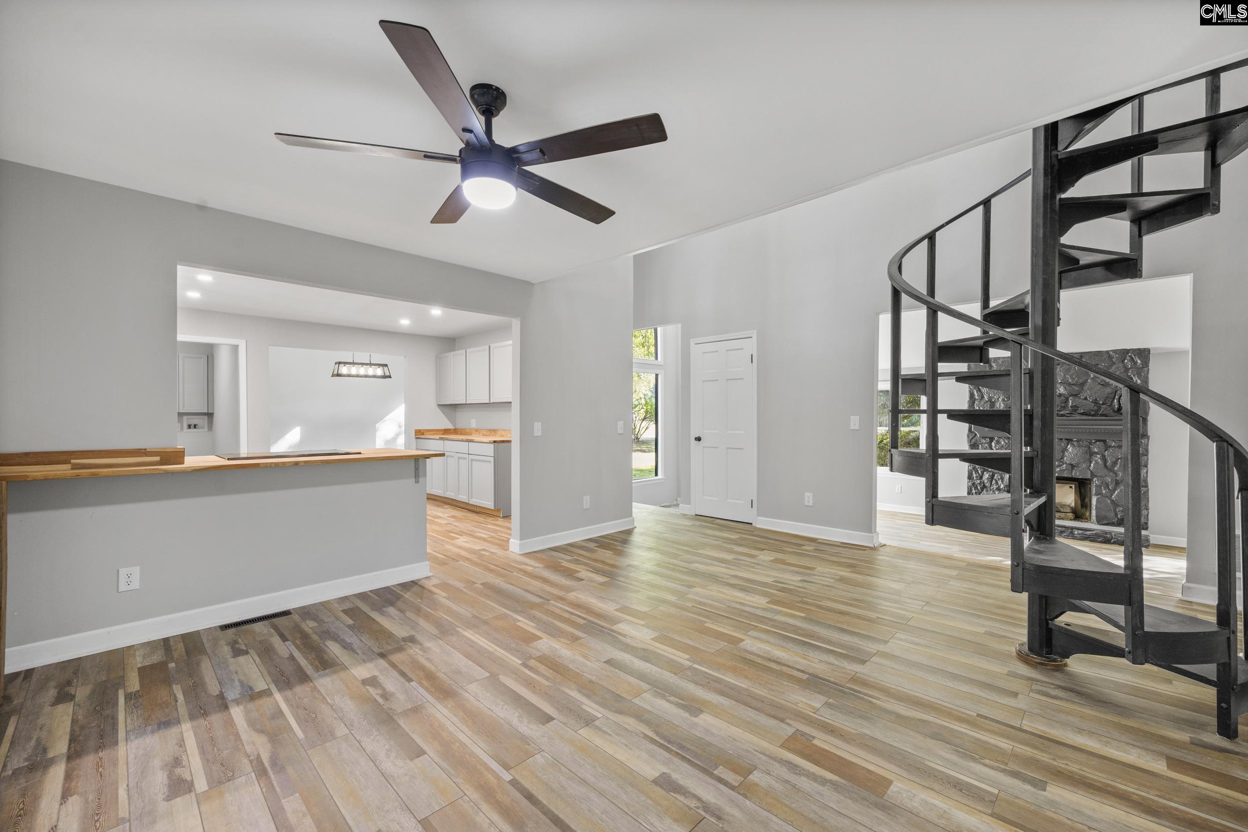 Kitchen to the left. Foyer in the Center. Great Rm to the Right. Kitchen Bar extends into Living Rm