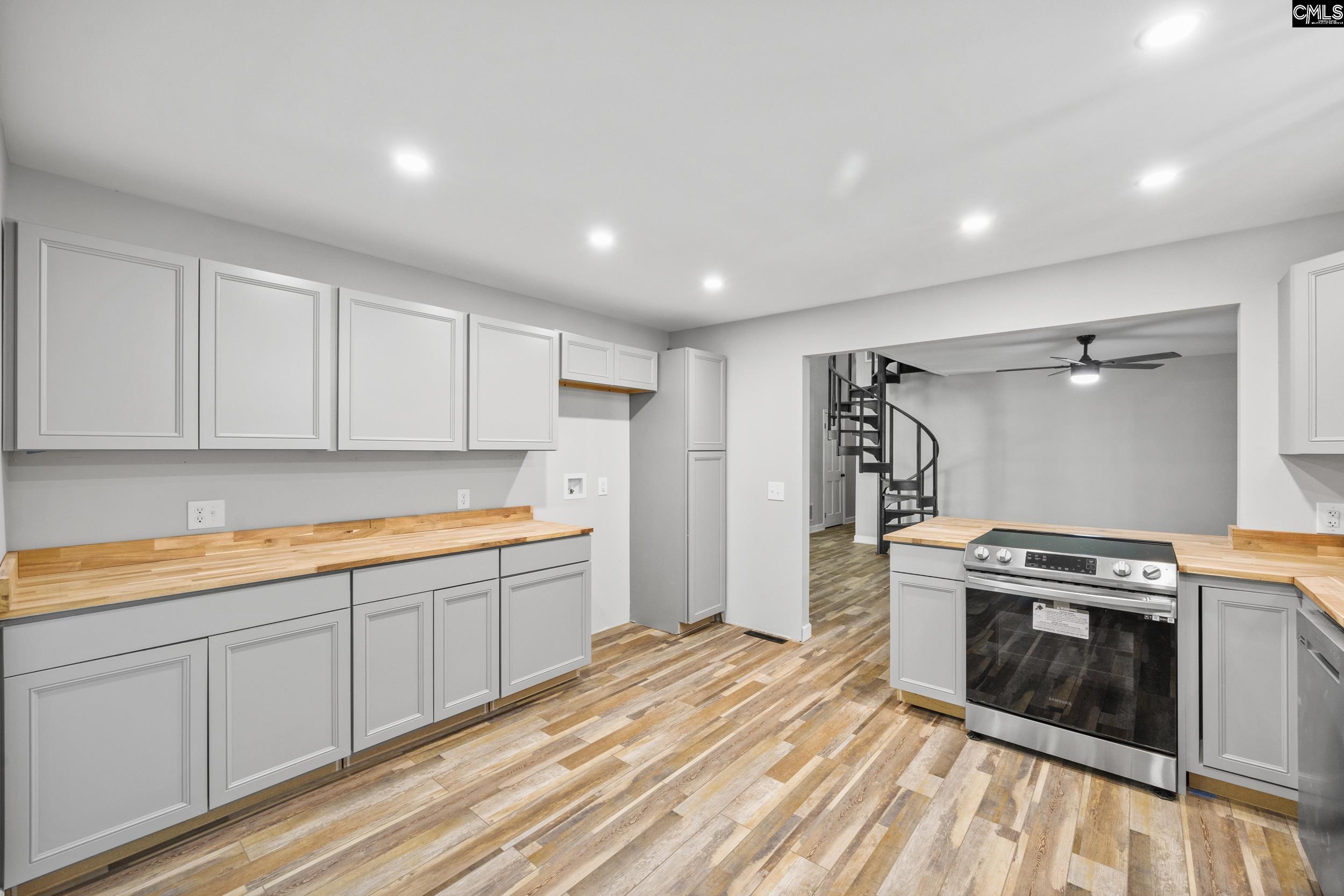 Looking into the Living Room with Cooktop and Bar.