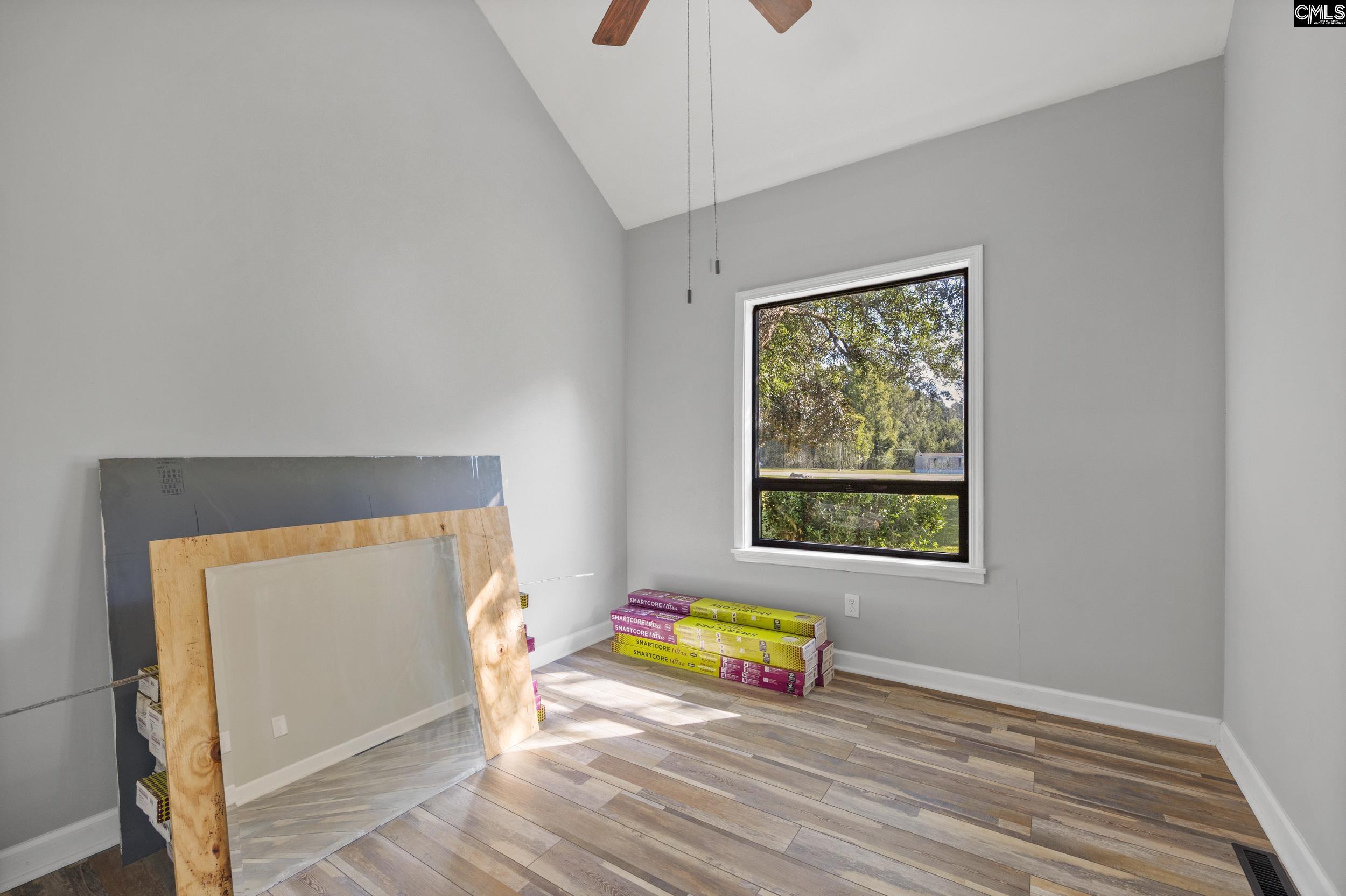 This room has Vaulted Ceilings, but no Closet. It is directly across from the Shared Bathroom