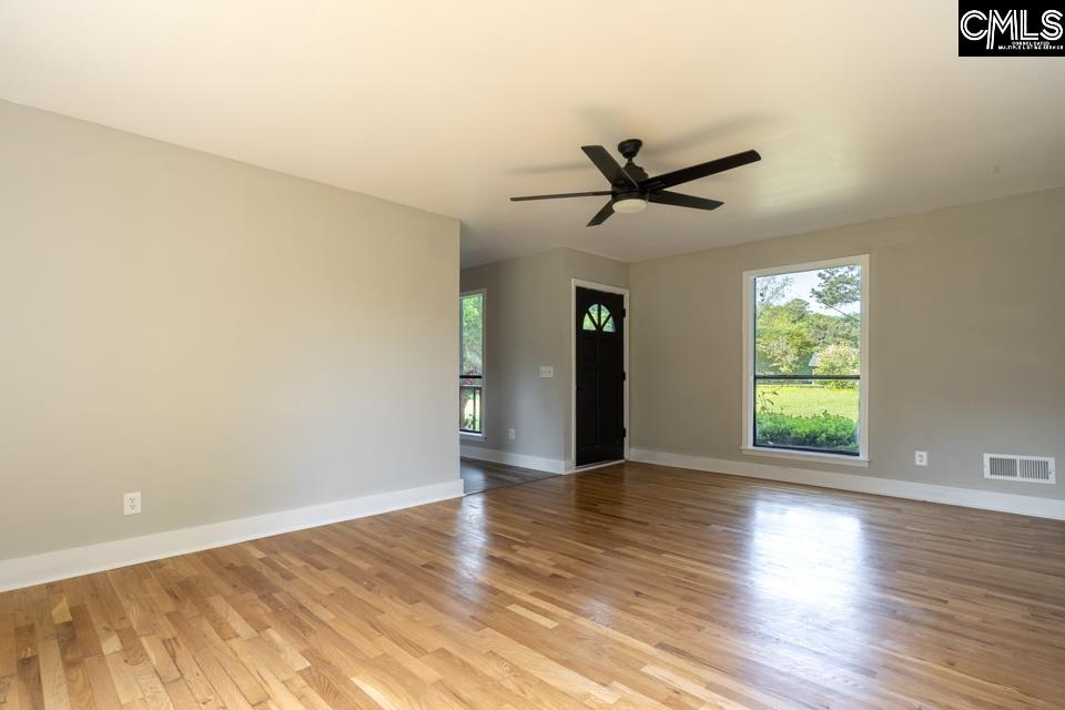 Front door opens into the living room and looks into the breakfast/ dining area