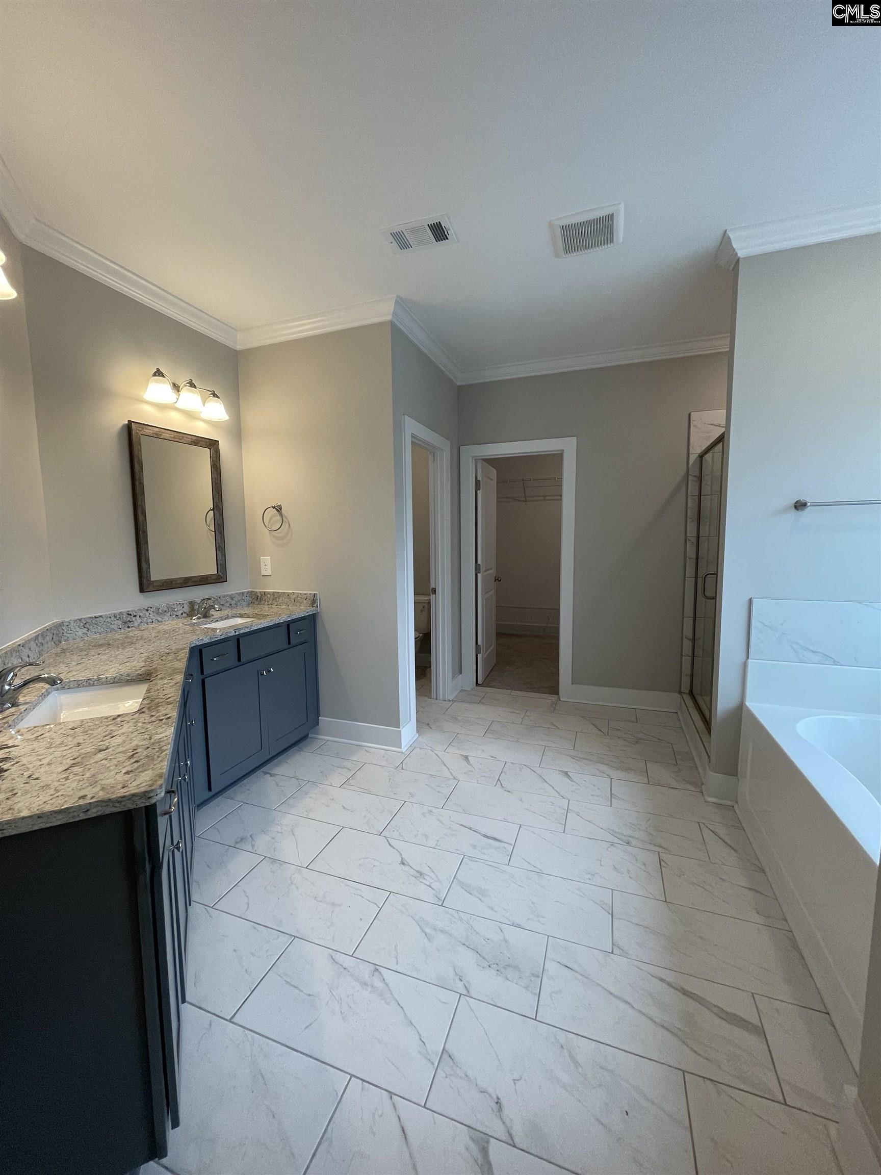 spacious bathroom includes a linen closet