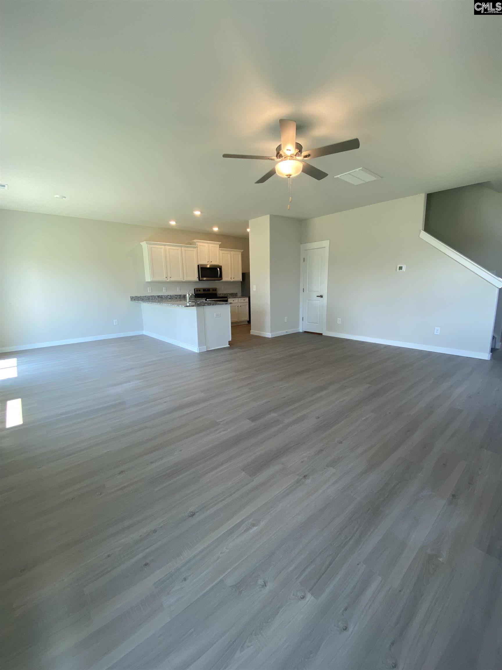 The large family room is located directly off the kitchen, allowing for plenty of room to entertain.