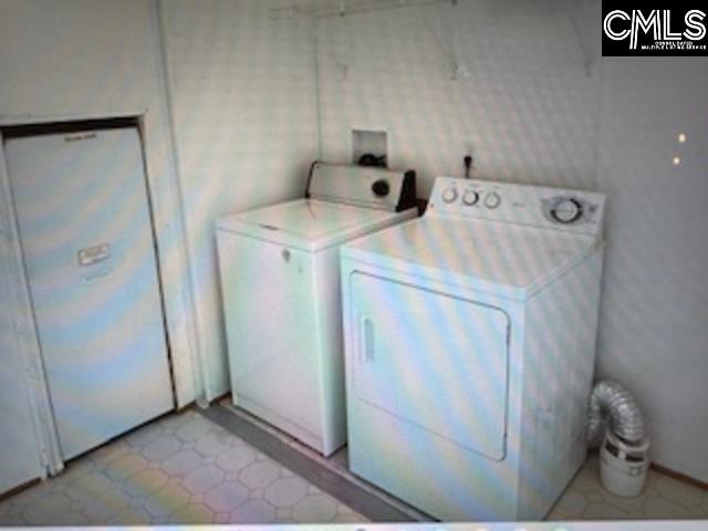 Laundry room with electric water heater, washing machine & dryer