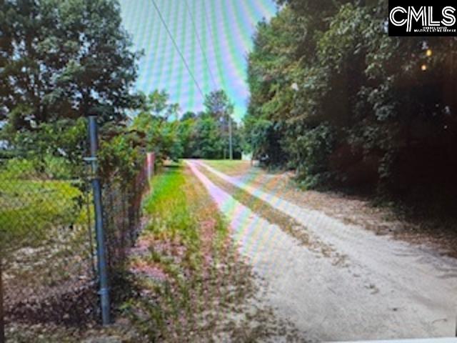 Driveway from road to residence, on the right.