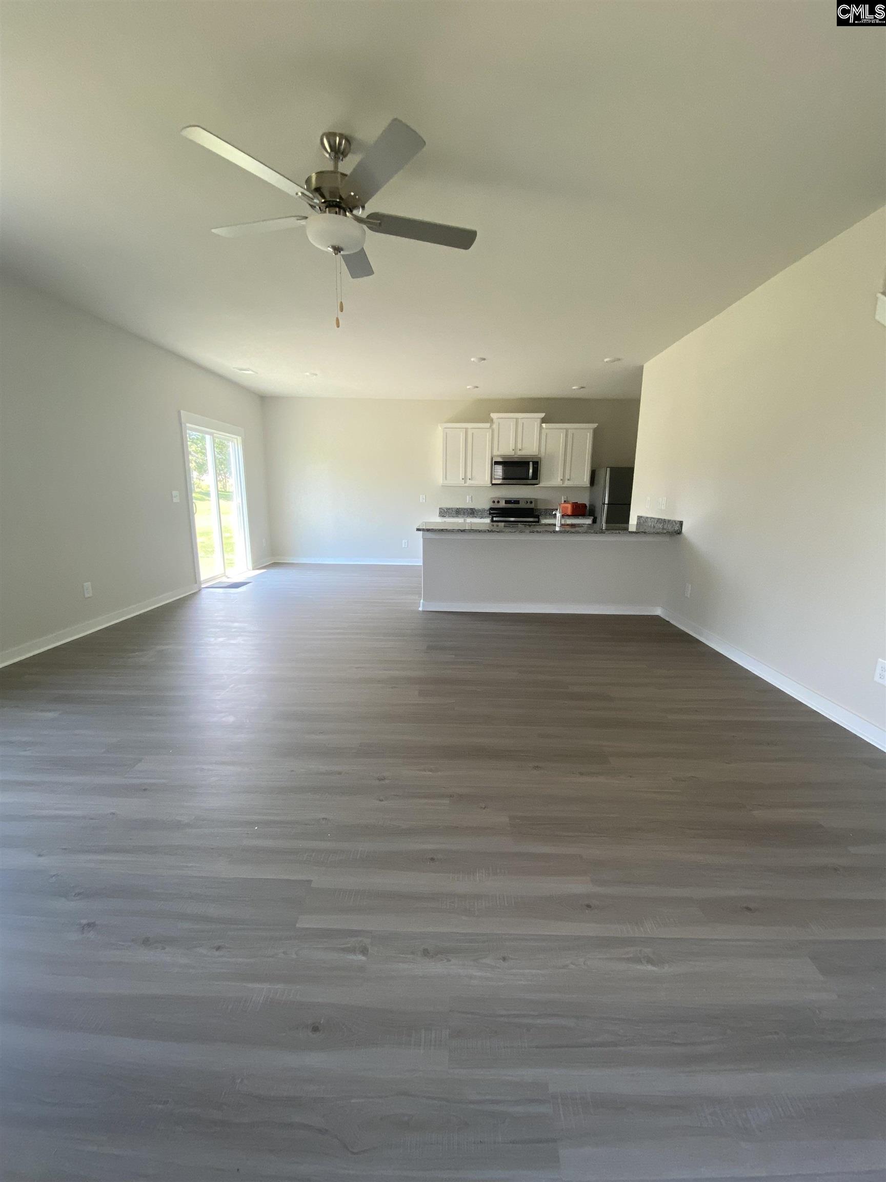 The large family room is located directly off the kitchen, allowing for plenty of room to entertain.
