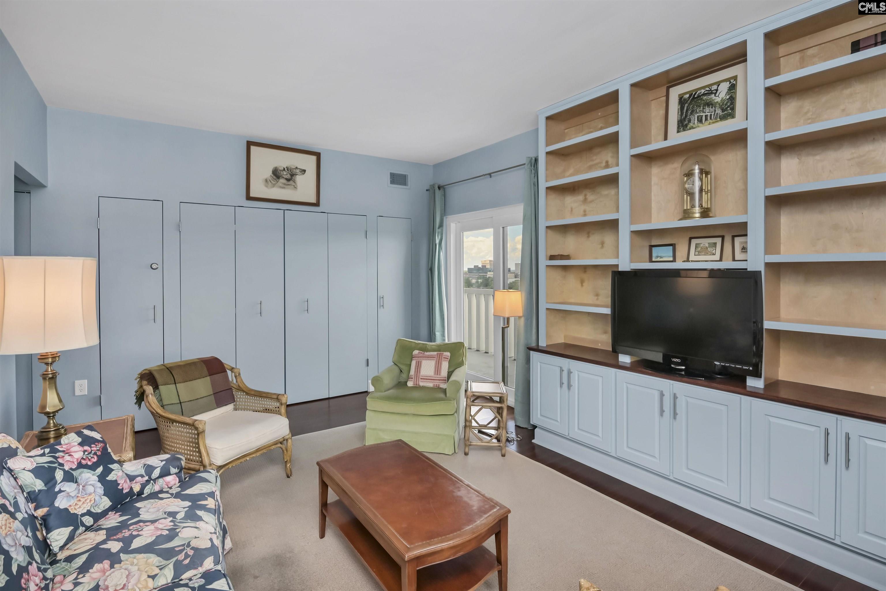 Note the beautiful bookcases. Also, this room features a hidden desk area behind bi-fold doors.