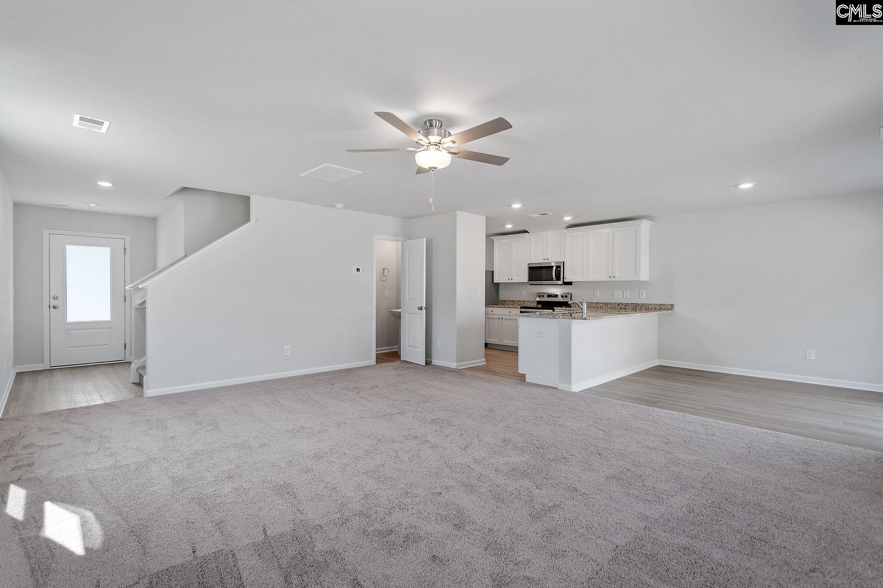 The large family room is located directly off the kitchen, allowing for plenty of room to entertain.