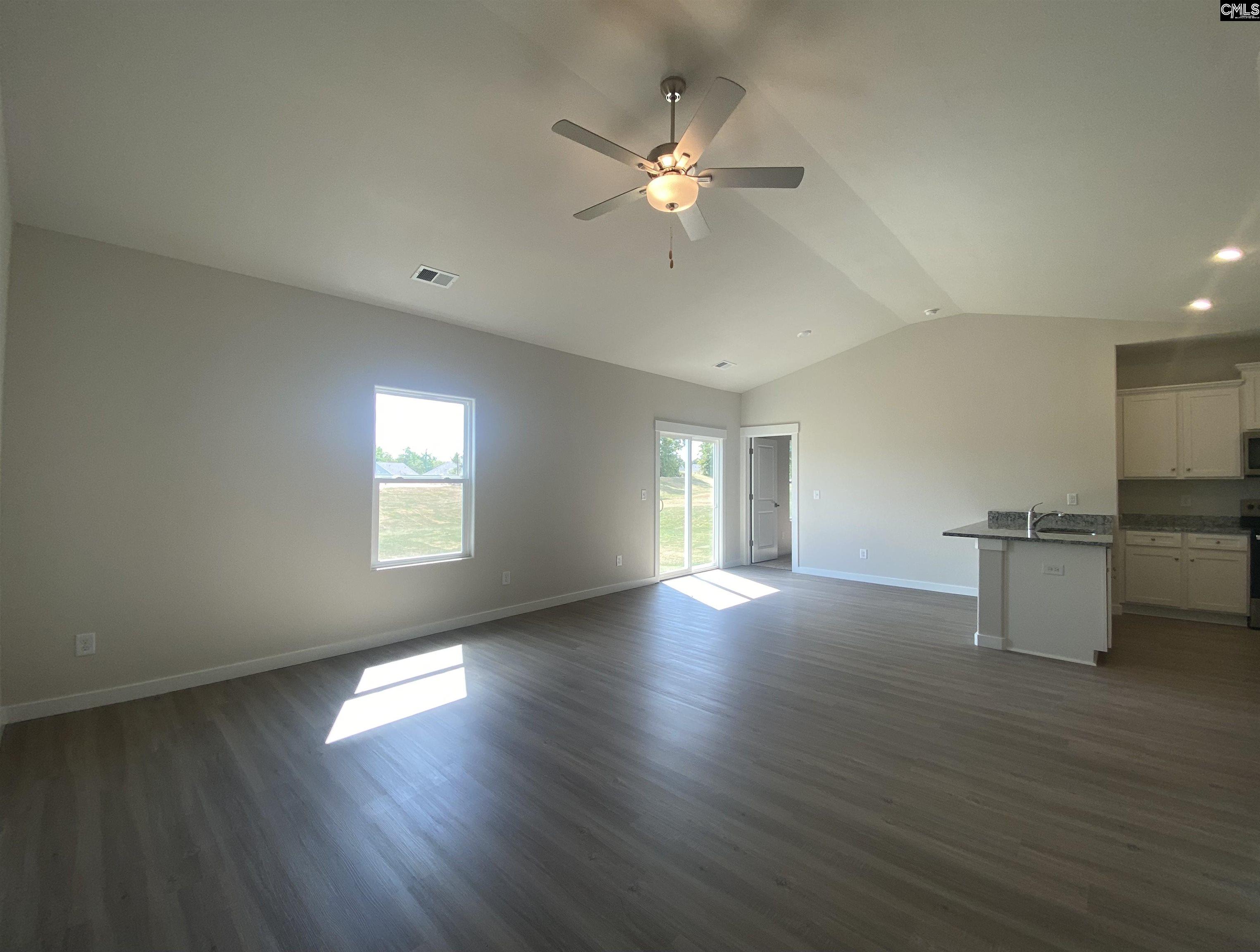The large family room is located directly off the kitchen, allowing for plenty of room to entertain.