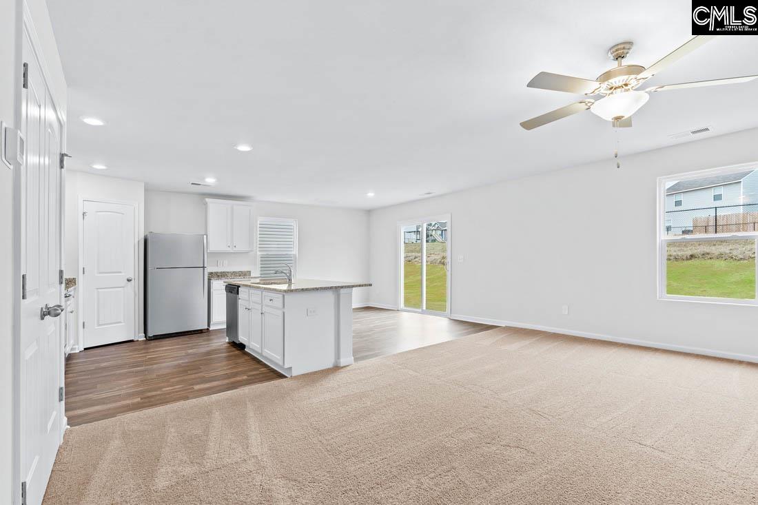 The large family room is located directly off the kitchen, allowing for plenty of room to entertain.