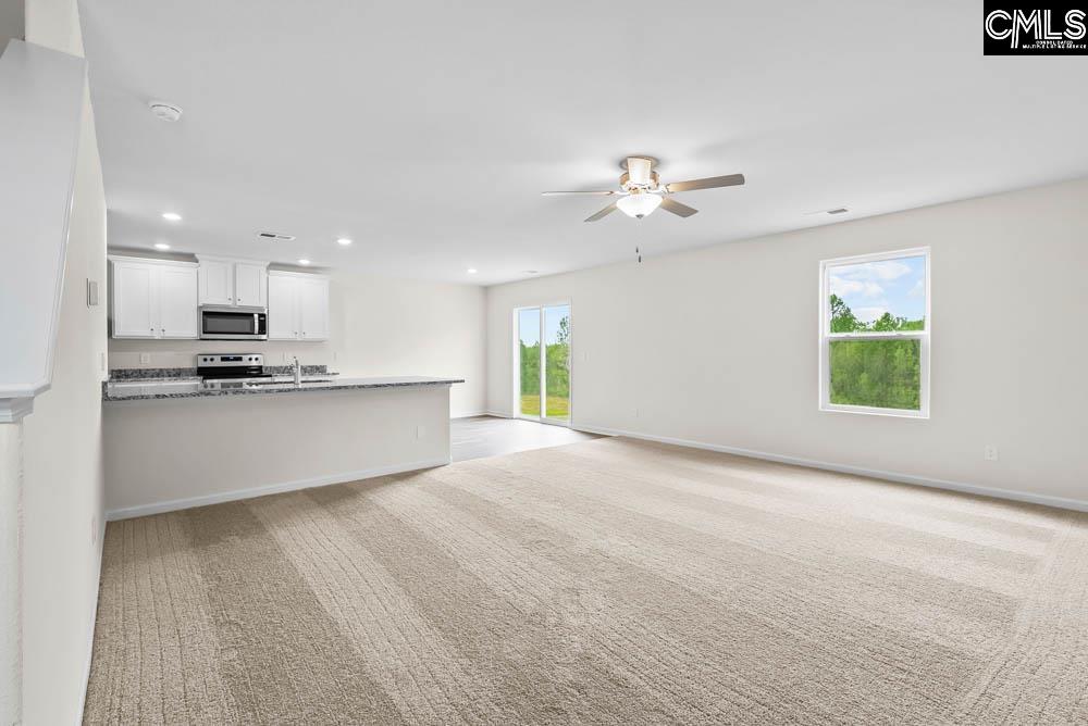 The large family room is located directly off the kitchen, allowing for plenty of room to entertain.