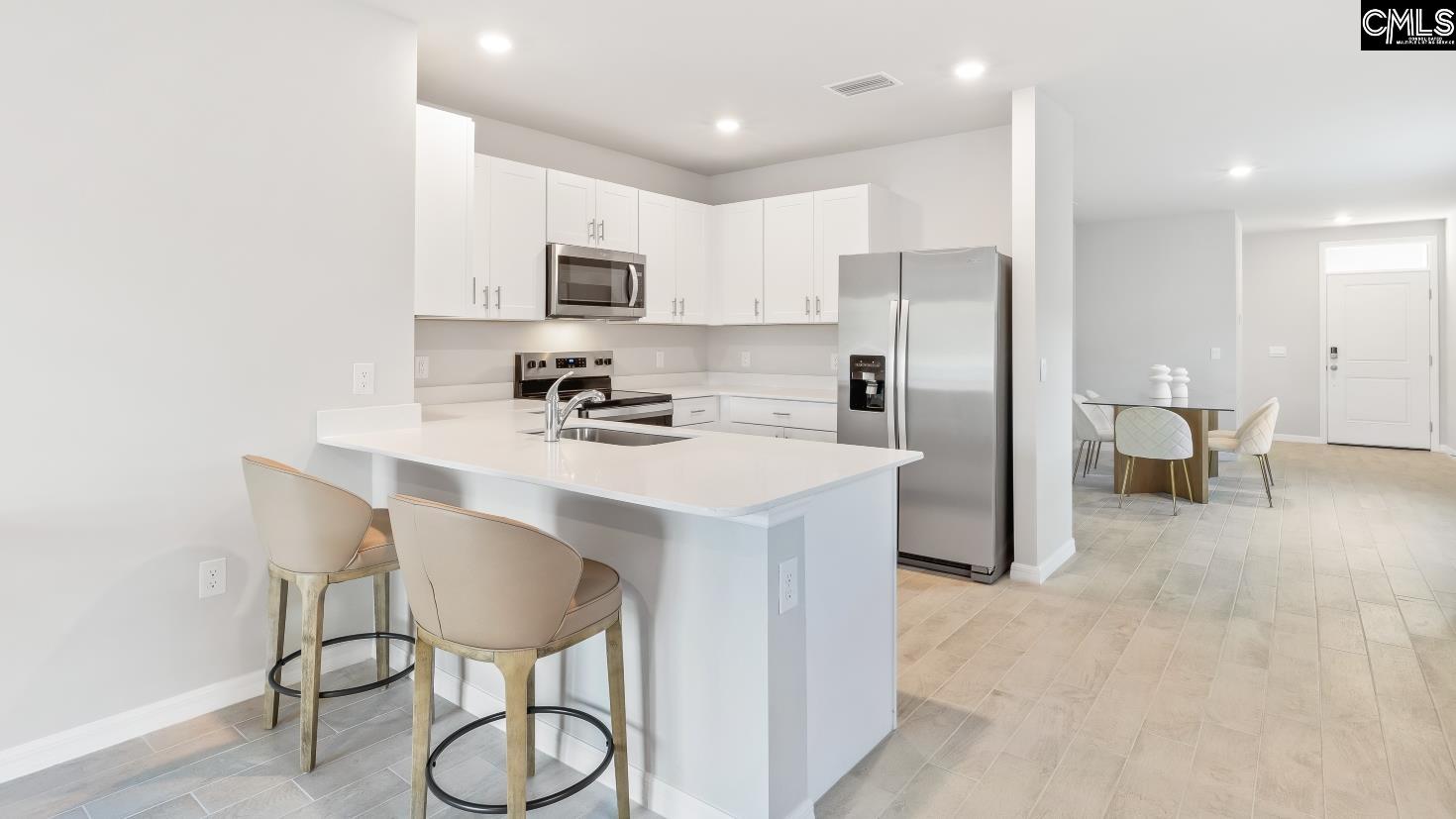 *White cabinets are pictured, but this home will have gray cabinetry