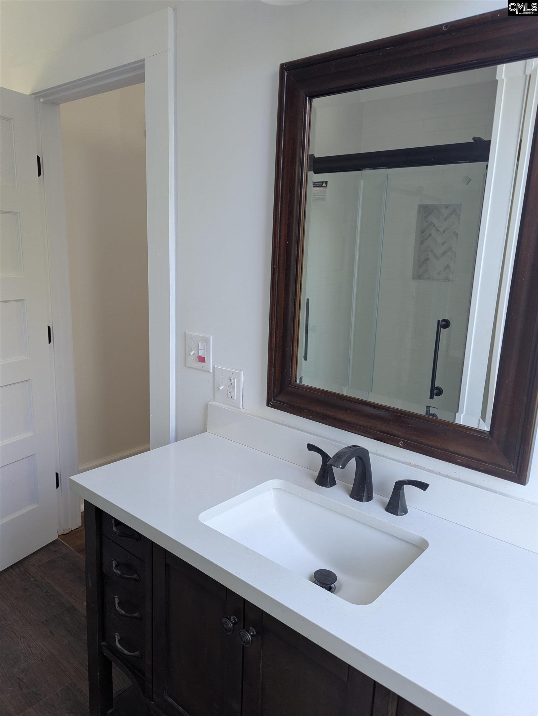 The primary bath has a linen closet, separate shower and free standing tub.