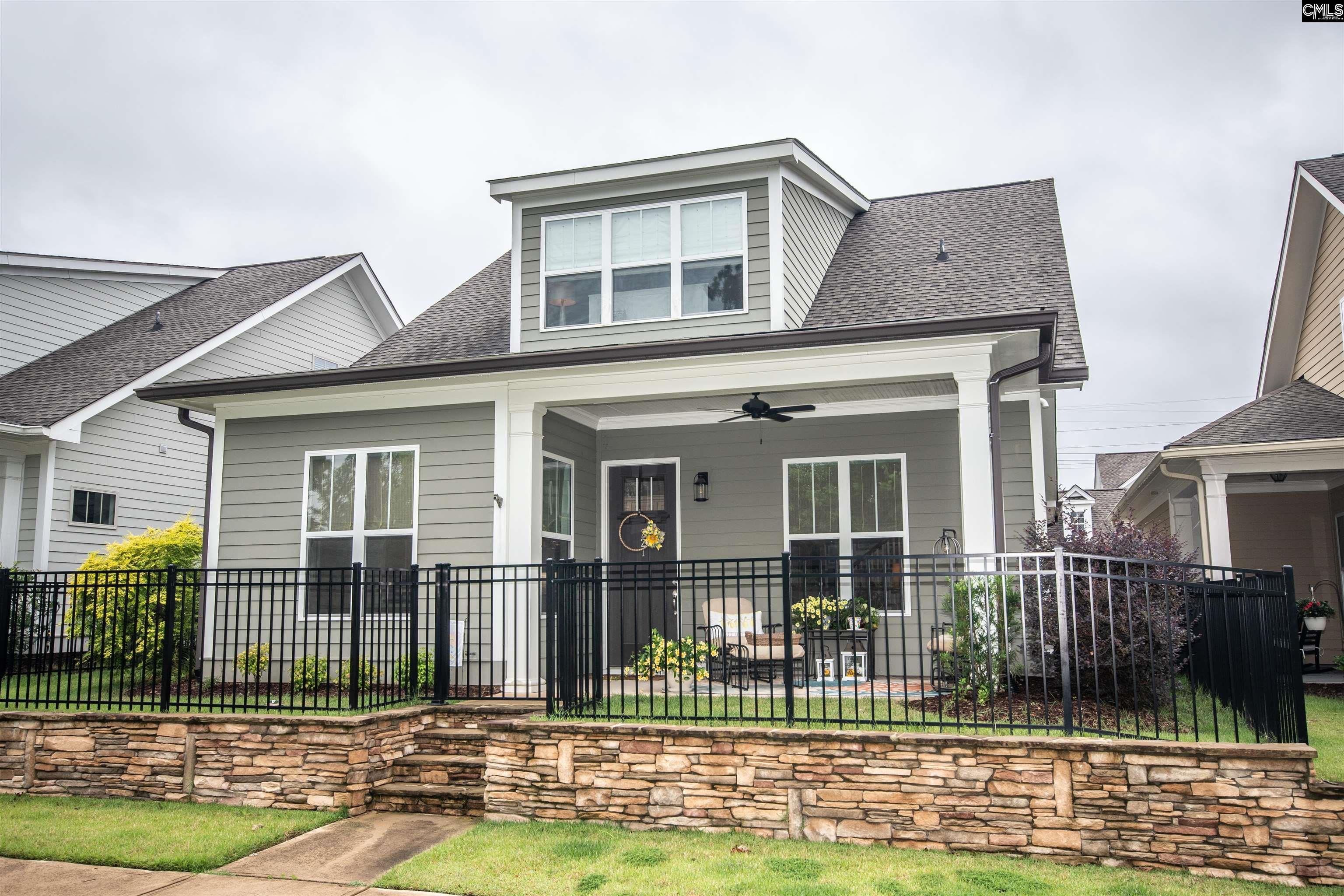 Fully fenced yard with new sod and bushes.