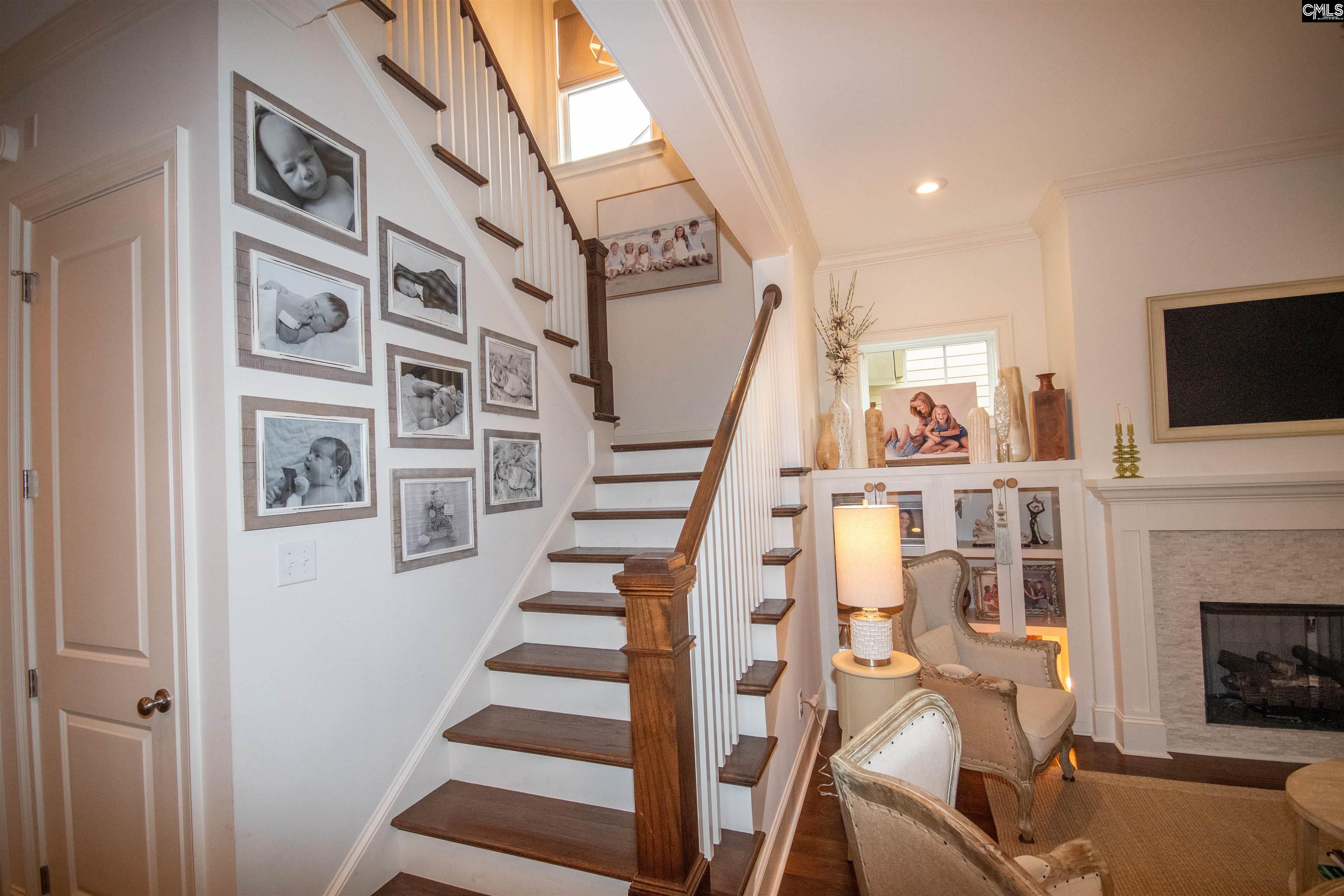 Features new chandelier & wood treads.