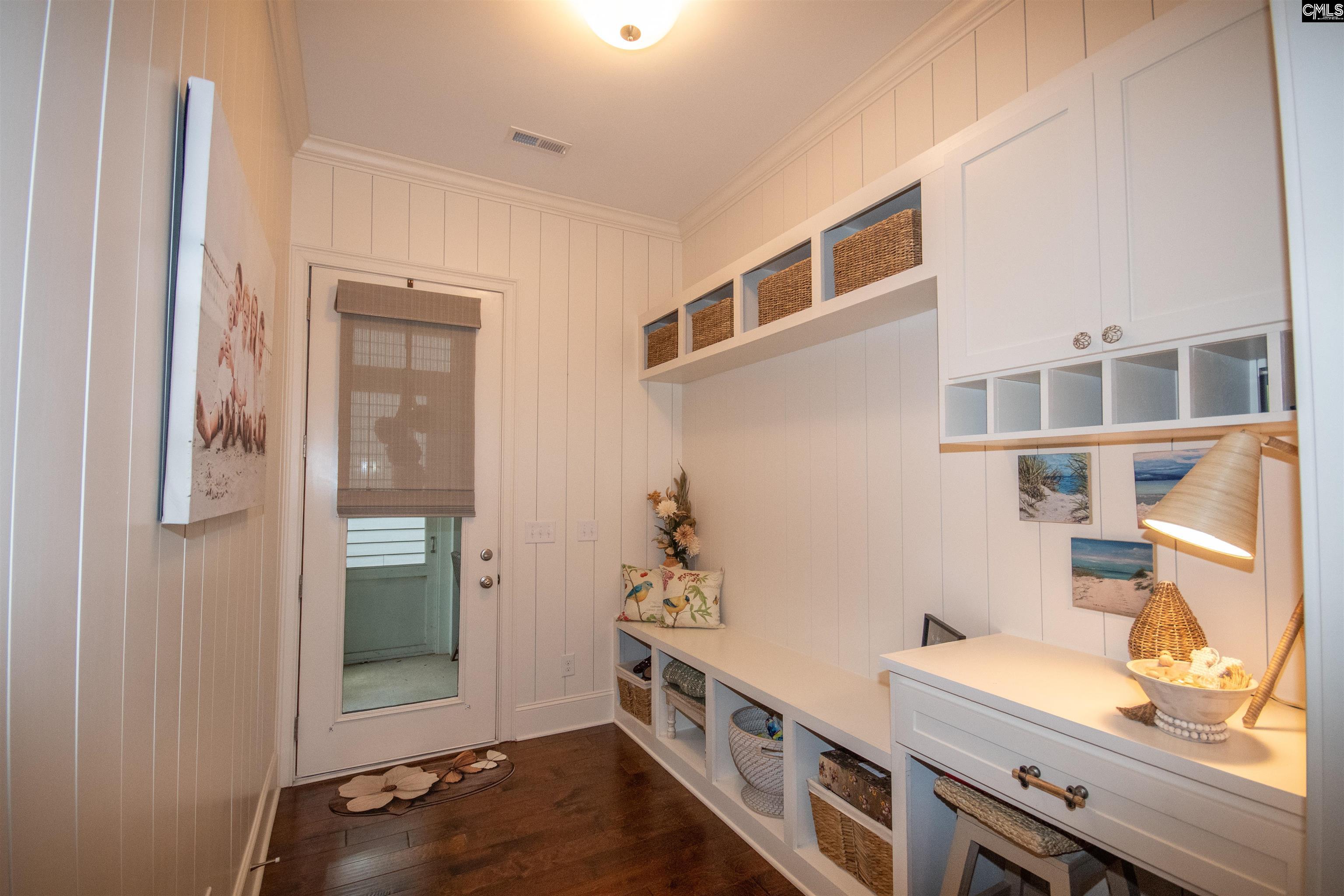 Features shiplap, lots of cubbies, desk & cabinets.
