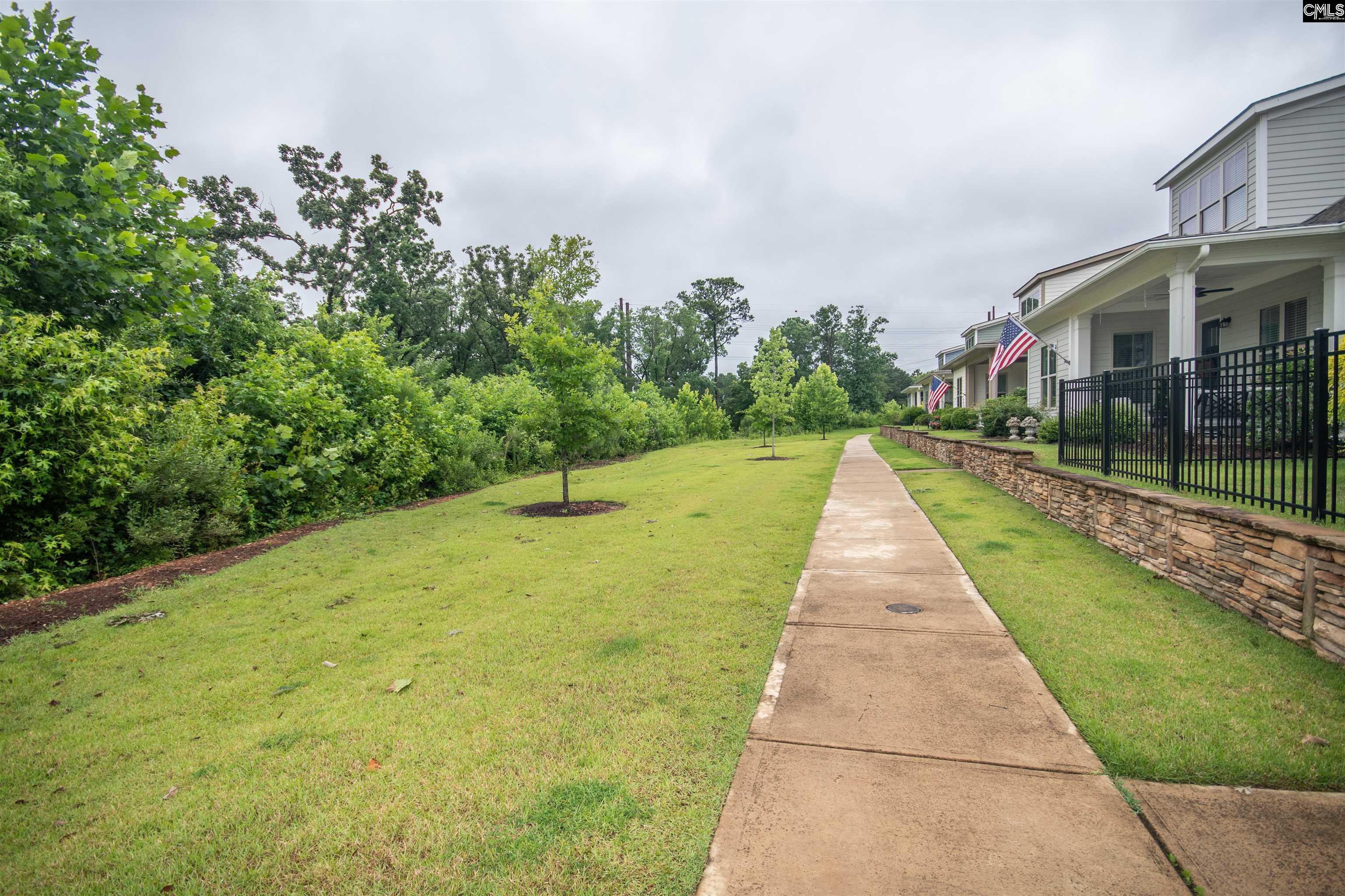 A walking trail runs directly in front of the house overlooking greenspace.  Very private.