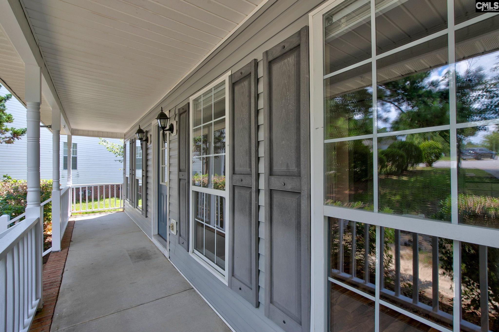 Rocking chair front porch perfect for hanging ferns