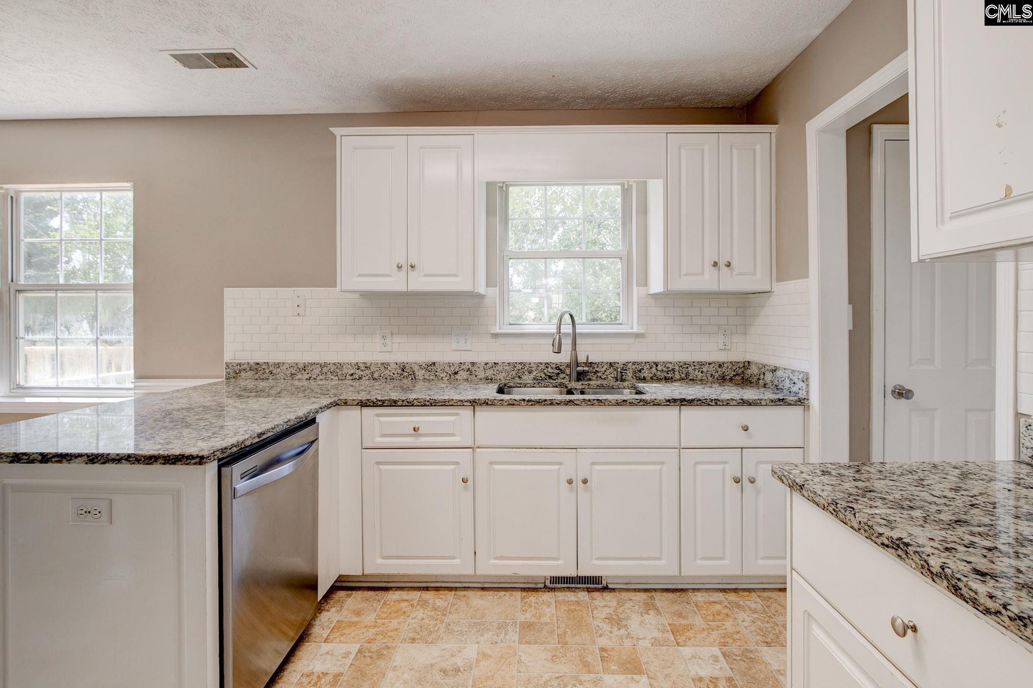 features granite, smooth top stove, dishwasher, pantry and fridge
