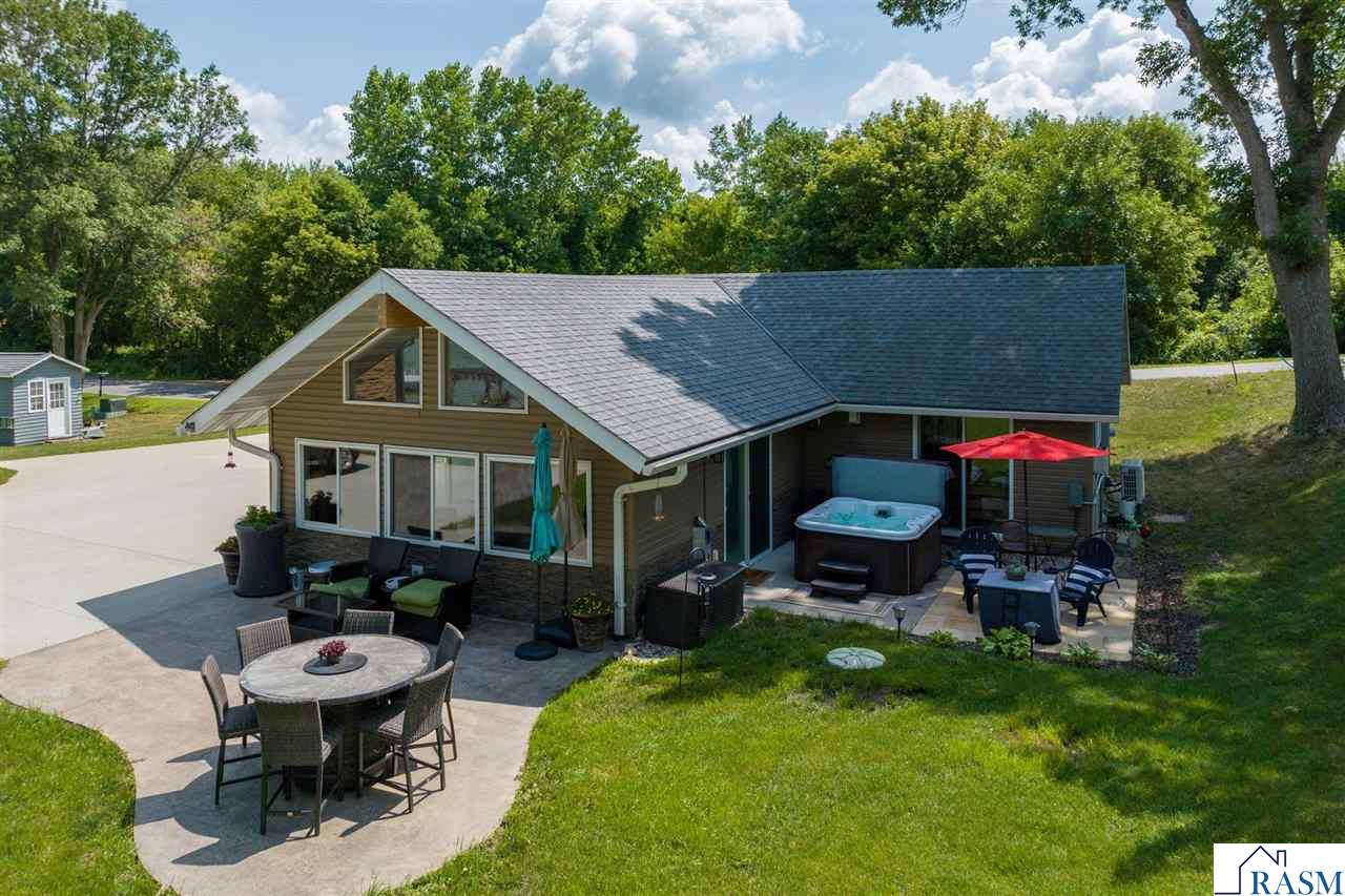 Looking for simplistic lake living? This is the property for you!  This 1 bedroom, 1 bath cabin on Lake Washington has been completely rebuilt over the last 10 years.  This property has been used year-round over the years and is a perfect low-maintenance cabin.  The home is "turn key" and will be sold furnished with all the furniture inside and outside including all patio furniture, a 1 year old hot tub, the dock, a 2018 Bennington Tritoon (21 ft.) with a 150 hp Yamaha engine complete with sea legs, the pontoon canopy, 2 kayaks, a canoe, a new paddle board, new kitchen appliances, washer, dryer and so much more!  The lot features 40 ft. of lake shore with a gentle slope to the lake from the house. This property is very easy to maintain, offers beautiful views of the lake and sunsets and is the perfect place to make memories.  Set up your private showing today!