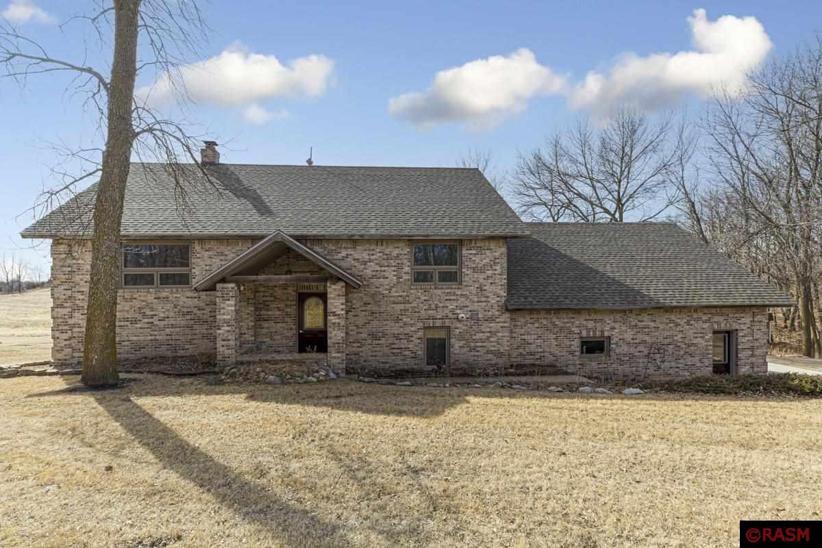 Stunning 5-Bedroom Home on 5 Scenic Acres Just Outside Montevideo, MN. Experience the perfect blend of peaceful country charm and modern convenience in this spacious and beautifully maintained 5-bedroom, 3-bathroom home, set on 5 picturesque acres just minutes from Montevideo. With its warm and inviting atmosphere, this property is designed for both comfort and functionality, offering ample space to relax, entertain, and enjoy the beauty of nature. Step inside to an expansive open-concept kitchen, dining, and living area, where a stunning wood-burning fireplace serves as the heart of the home, adding warmth and character. The bright and airy sunroom, bathed in natural light, provides a tranquil retreat with a door leading to the spacious composite deck, perfect for morning coffee or evening sunsets. The primary suite is a true sanctuary, featuring a private en suite bathroom, dual closets, and plenty of space to unwind. Additional bedrooms are generously sized, offering flexibility for family, guests, or a home office. A versatile recreation room above the attached two-stall garage provides even more living space, perfect for a game room, media room, or creative studio. Outside, the property is a nature lover’s dream, with lush greenery, mature trees, and open spaces ideal for gardening, recreation, or simply enjoying the great outdoors. Gather around the cozy fire pit on cool evenings, store tools and equipment in the garden shed and storage shed, and make the most of your private, scenic retreat. This rare gem offers the best of serene rural living while being conveniently close to town amenities. Don’t miss your chance to own this incredible property—schedule your private showing today!