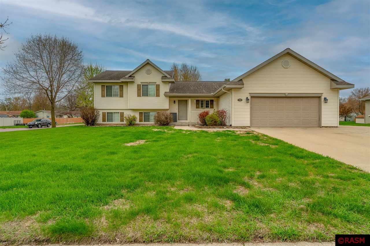 Have you been thinking about making a move to Madelia? Now is your chance! Homes like this spacious 5-bedroom, 2-bathroom tri-level rarely hit the market—don’t wait to schedule your showing! Thoughtfully designed with both comfort and function in mind, this home offers generous living space, a desirable layout, and charm throughout. Step inside from the attached two-stall garage into a versatile mudroom—ready to be customized with cubbies, benches, or hooks to keep everyday clutter tucked away. The heart of the home is the bright, open kitchen, featuring a lovely view of the front yard and a convenient bar area—perfect for a quick bite, morning coffee, or catching up on emails. From there, flow into the spacious dining room, ideal for gatherings big or small, with direct access to the back deck and a beautifully maintained backyard. Just off the dining room is a cozy living room, creating a warm and welcoming main floor with ideal flow for both daily living and entertaining. Upstairs, you’ll find three generously sized bedrooms and a full bathroom, tucked away from the main living area for added privacy. On the lower level, enjoy another inviting living area flooded with natural light, plus two additional bedrooms and another full bathroom. Need even more space? The finished basement offers endless possibilities—home gym, game room, theater, or hobby space—along with a dedicated storage room and a utility/laundry room for added convenience. Outside, the home sits on a large corner lot with mature trees, a 12x12 shed, an expansive driveway, and a welcoming deck perfect for relaxing or entertaining. Located in the heart of Southern Minnesota, Madelia offers small-town charm with easy access to Mankato, New Ulm, and Fairmont. With continued growth and community pride, Madelia is a hidden gem—and this home is your chance to be part of it!