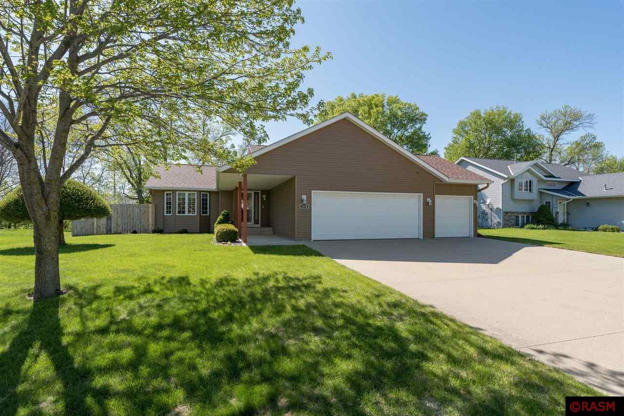 Welcome to 2176 Eagle Ridge Drive, a meticulously maintained, one-owner home nestled in a desirable Upper North Mankato neighborhood. Built in 1997 and thoughtfully updated throughout, this 4-bedroom, 2-bathroom home offers comfort, functionality, and modern style from top to bottom. Step inside to find stunning LVP flooring added in 2020 that flows throughout the main level, creating a clean and contemporary feel. The beautifully renovated kitchen is a standout feature, boasting Cambria quartz countertops, a stone backsplash, under-cabinet lighting, and newer appliances perfect for both everyday living and entertaining. Additional recent upgrades include a newer water softener and water heater, adding to the home's move-in readiness. Also, do not miss the massive crawl space storage in the basement level. The home’s exterior has seen major upgrades as well, including a new roof, seamless steel siding, gutters, and gutter guards in 2013 offering peace of mind and long-term durability. The fully fenced backyard, completed in 2023, is ideal for pets, play, or relaxing evenings outdoors. Car enthusiasts or hobbyists will love the oversized 3-stall garage, which is both insulated and heated providing year-round functionality. This is a rare opportunity to own a move-in ready home with thoughtful updates in a prime location. Don’t miss your chance to see this amazing home and schedule a showing today!